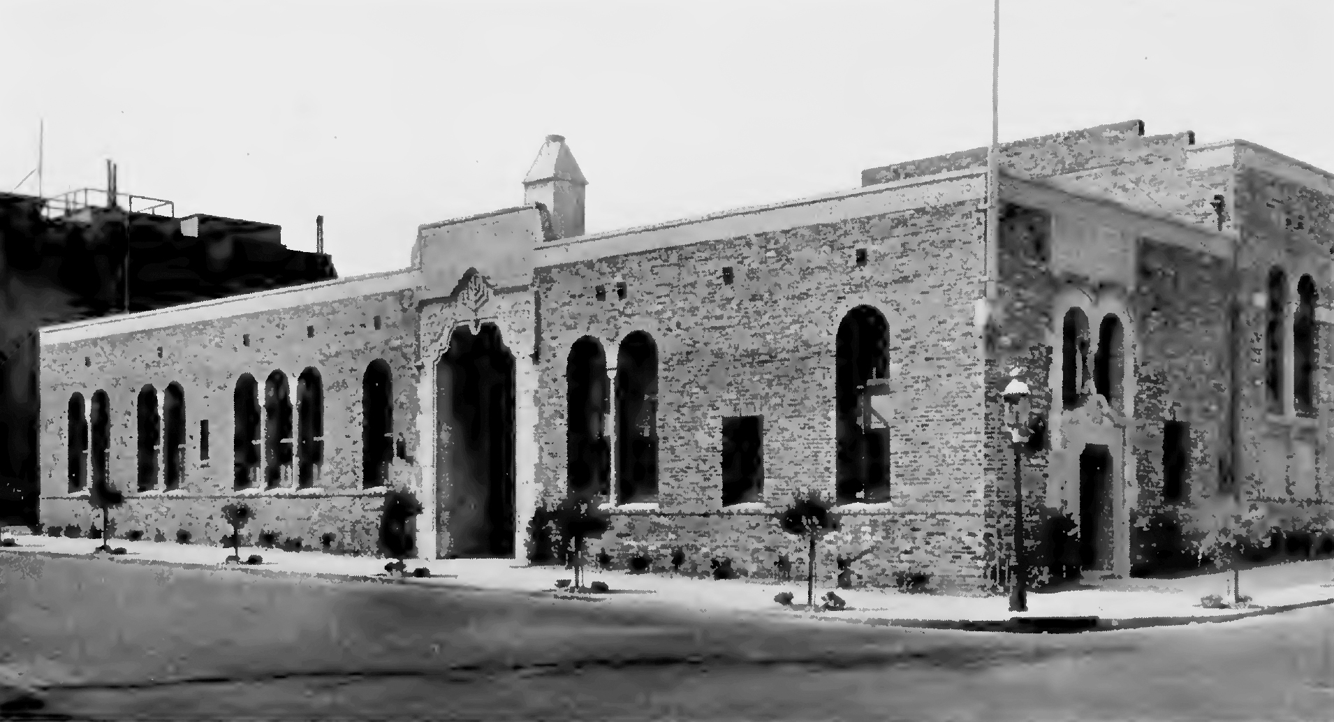 A historical picture that is black and white of the Alper Memorial Building, the Jewish synagogue.