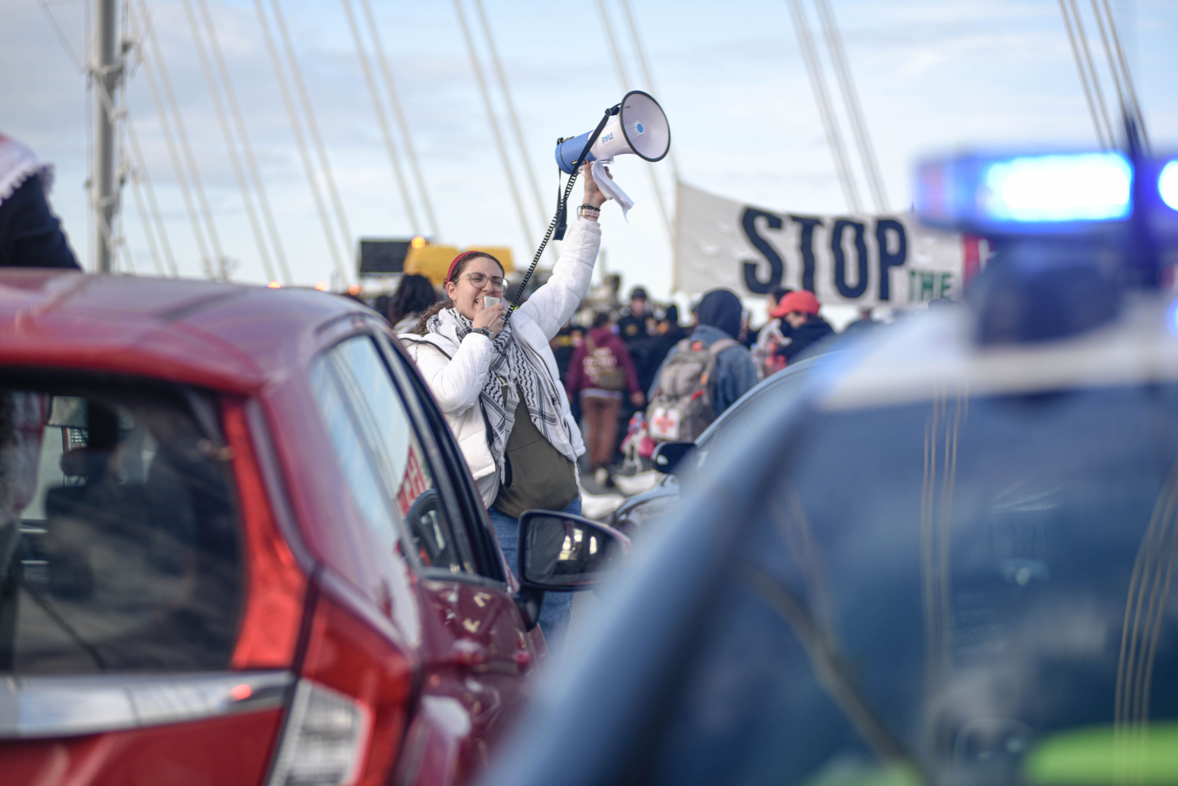 A protestor calling for a ceasefire in Gaza uses a megaphone during the protest which blocked traffic on the Bay Bridge for hours on Nov. 16, 2023.