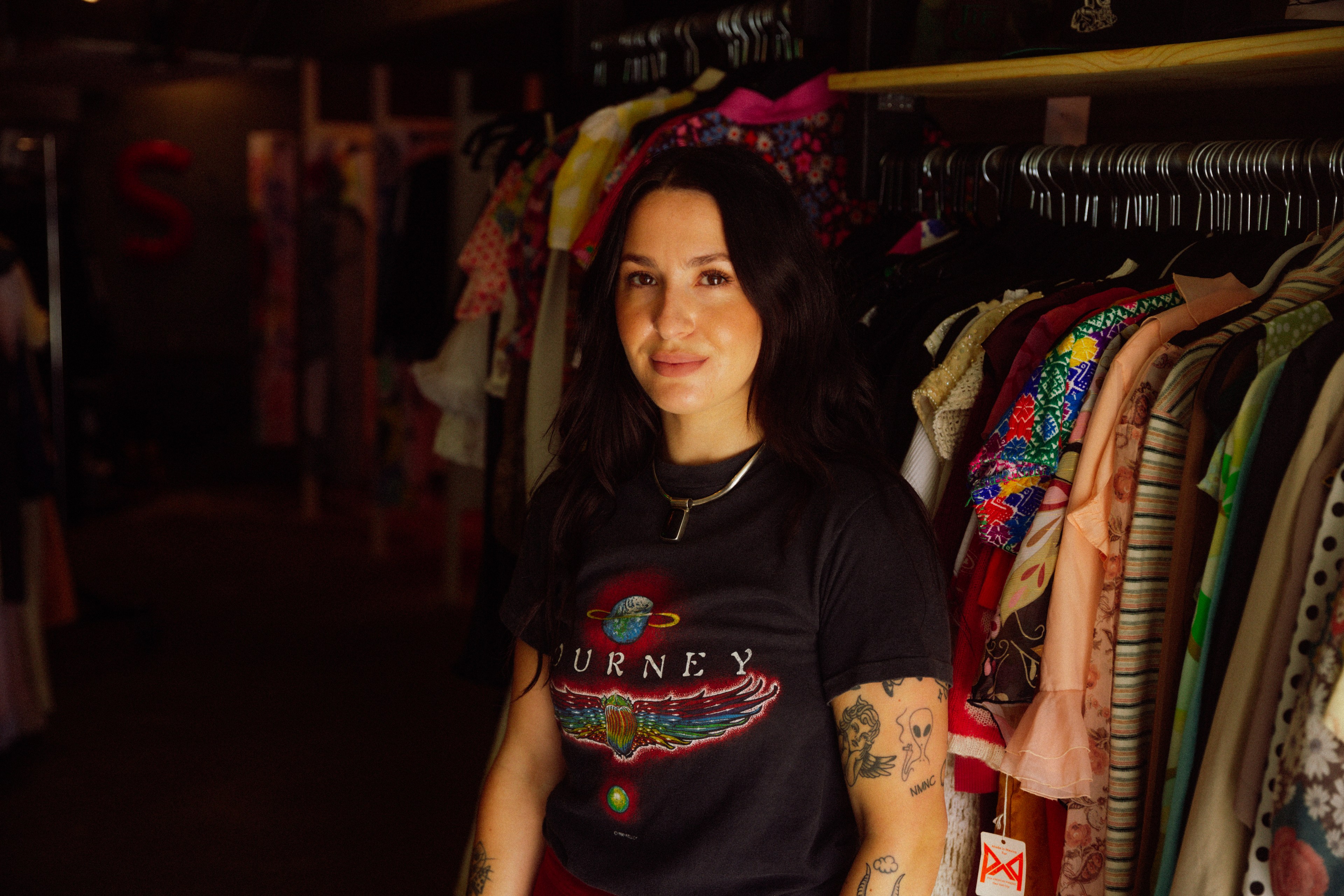 Sensitive Vintage proprietor Sivan Peleg stands in front of racks of clothes inside her pop-up fashion boutique housed in a converted garage in San Francisco's Mission District. 