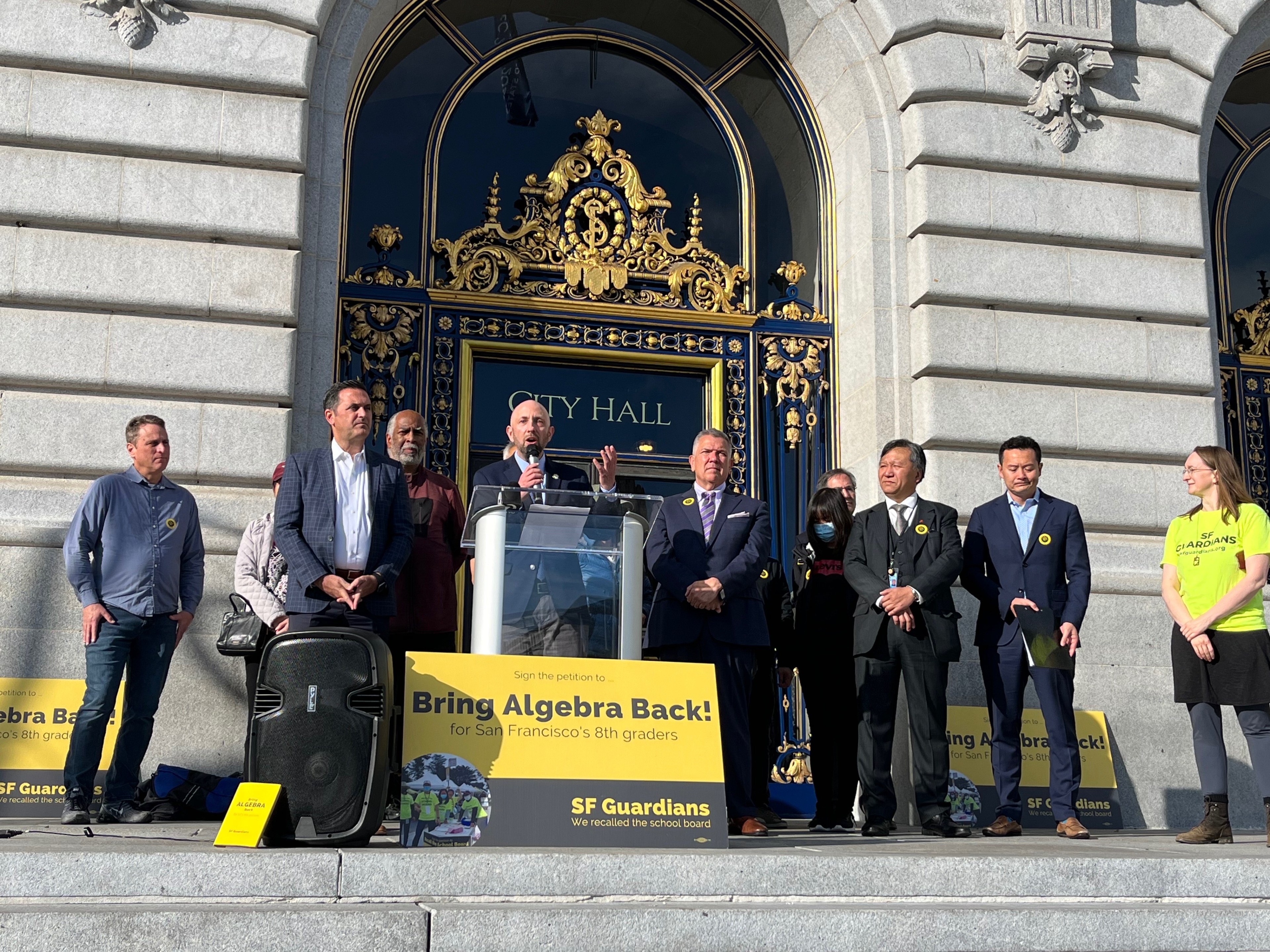 A group of lawmakers and residents rally outside City Hall in support of returning algebra to San Francisco middle schools.
