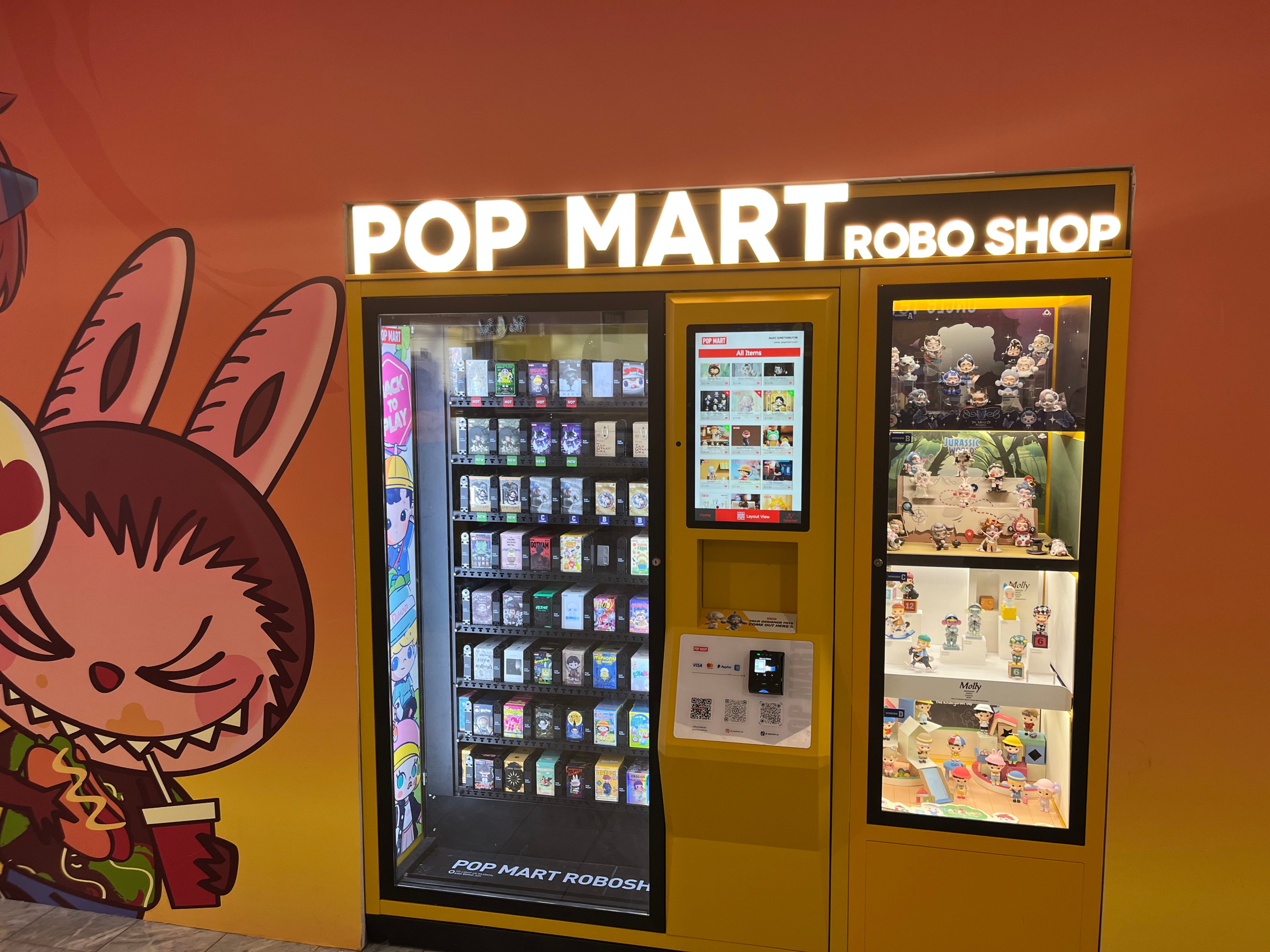 The Pop Mart Robo Shop is installed on the wall at Stonestown Galleria.