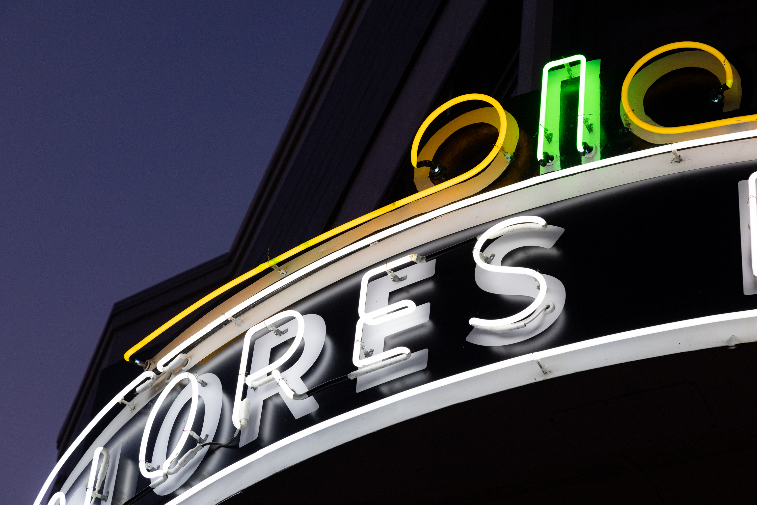 A detail from The Dolores Deluxe of their neon sign that reads &quot;...ORES&quot;