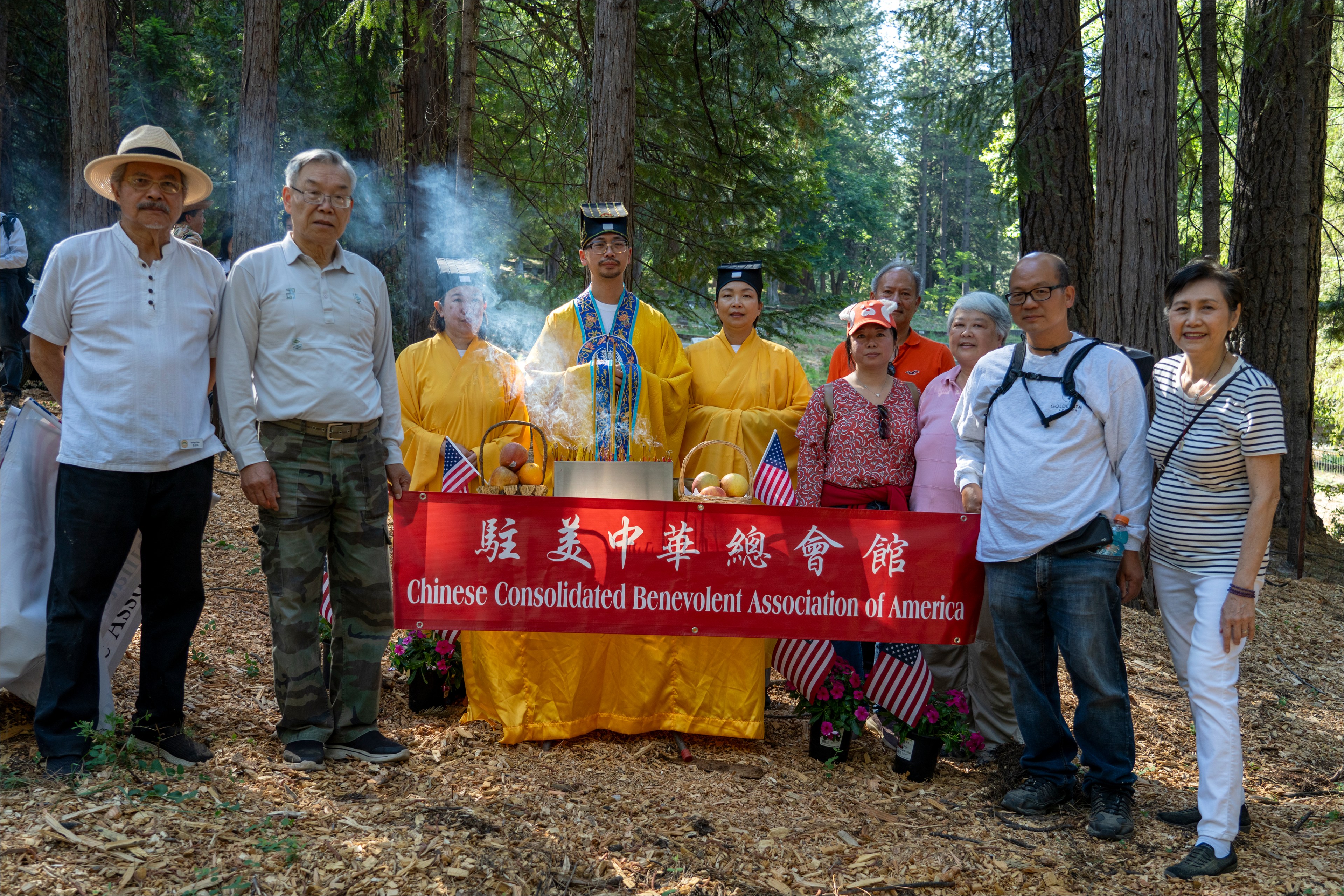 A group of people stand for a portrait.