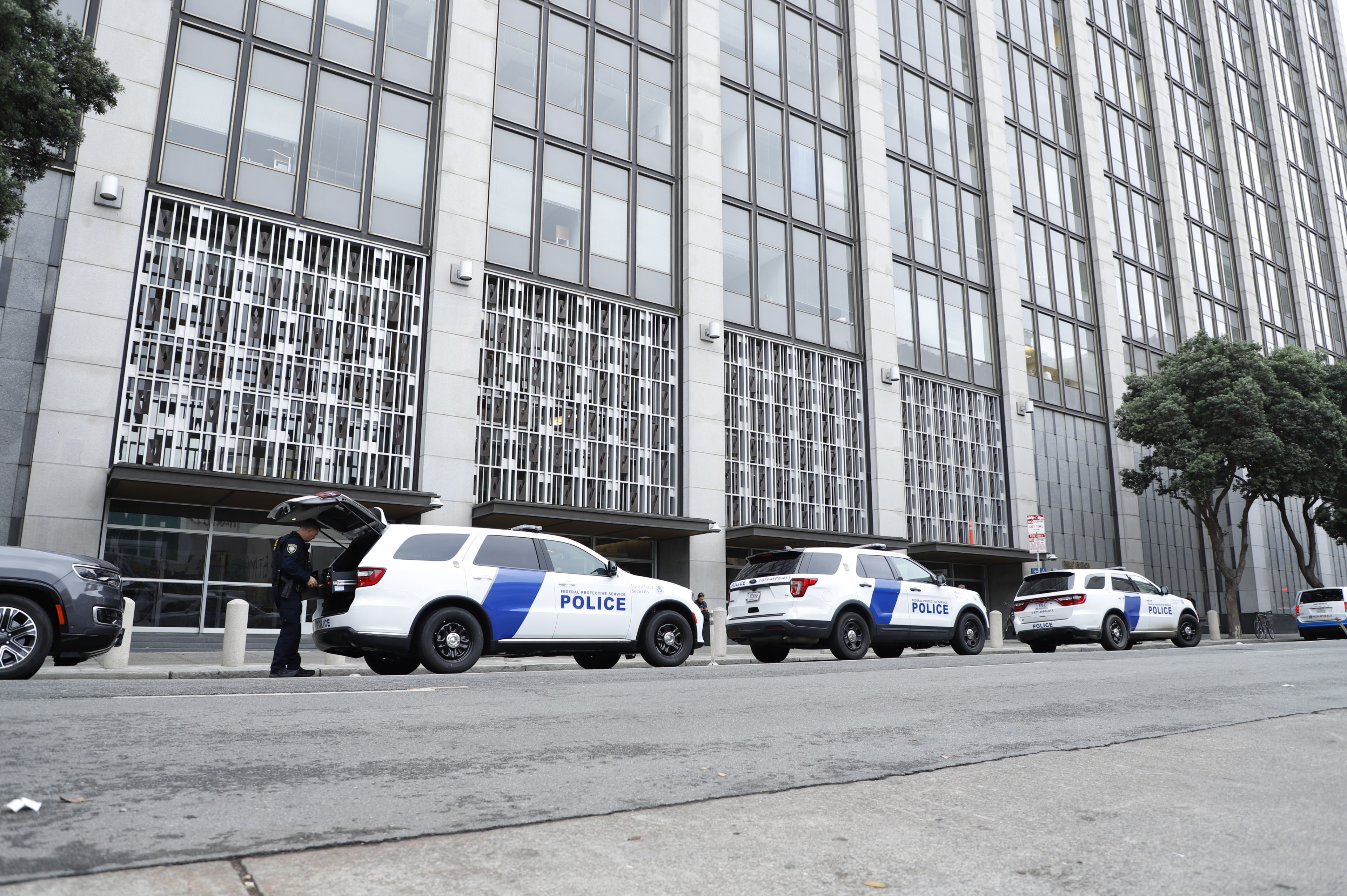 Police cars in front of a building