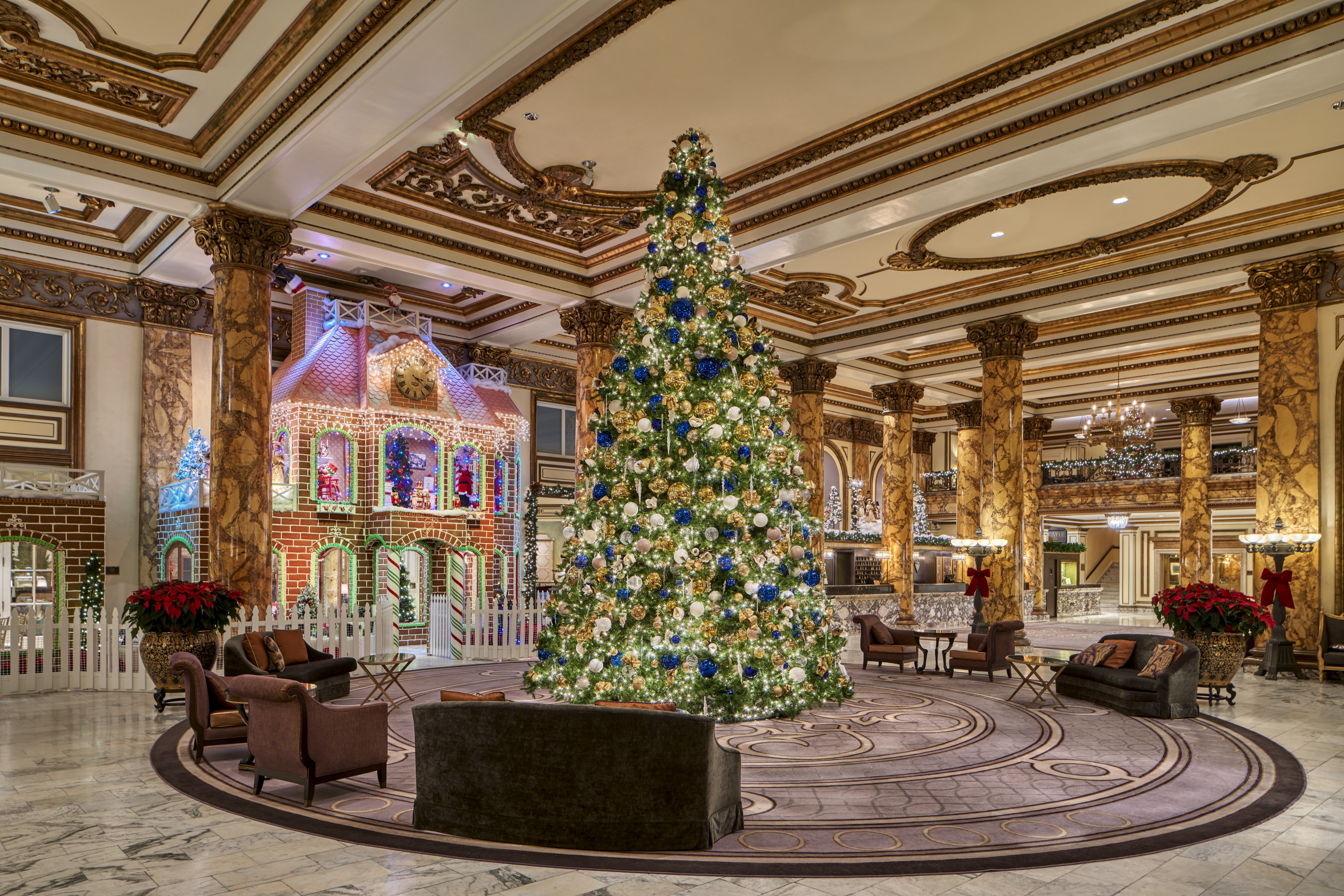 A 23-foot Christmas tree decorated with blue and gold ornaments, twinkly lights and icicles stands tall in the middle of the Fairmont hotel's elegant lobby, which also houses a life-size gingerbread house decorated with gingerbread bricks and See's Candies.  
