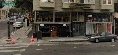 The front of a business appears on a San Francisco street.
