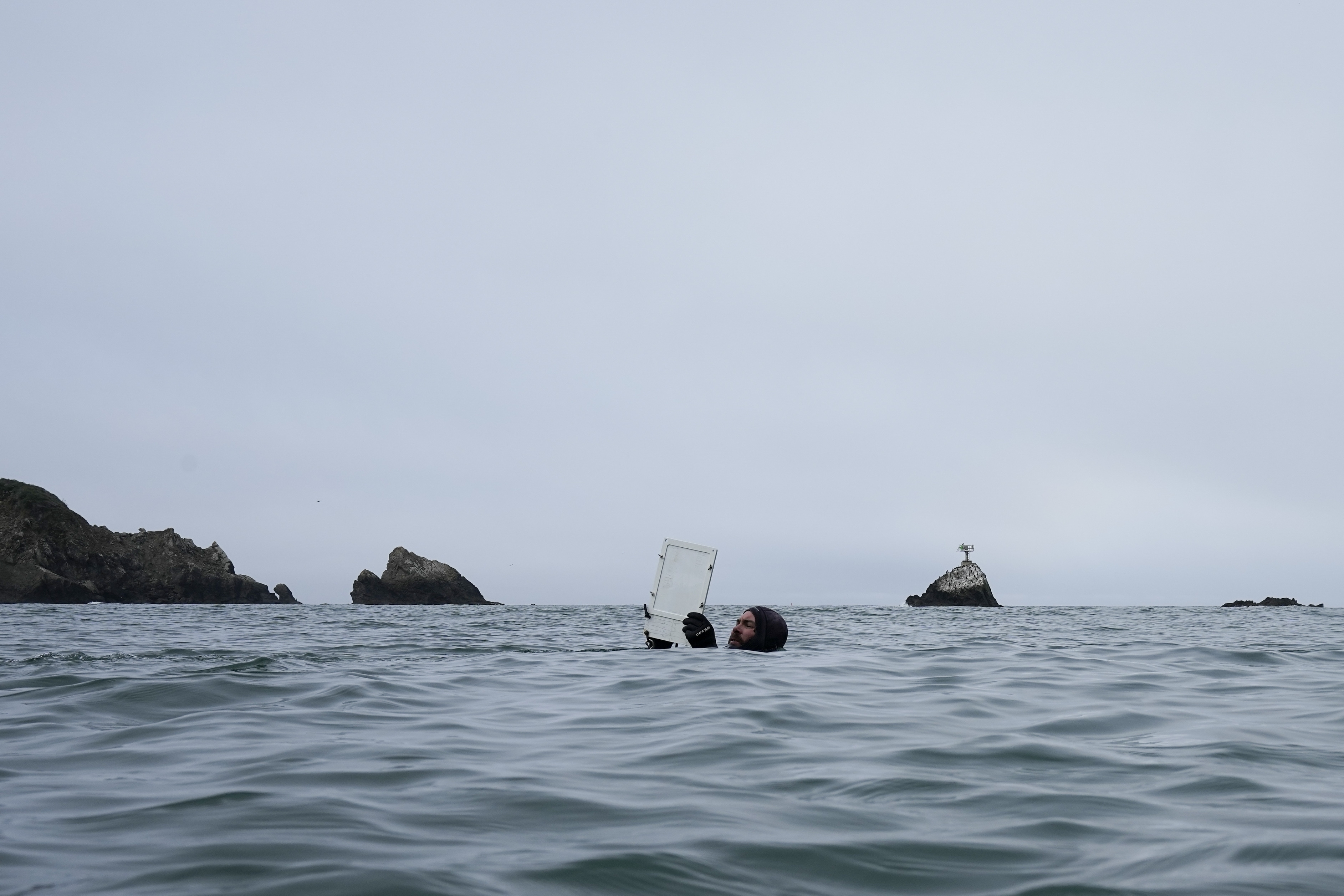 A diver floats on the water