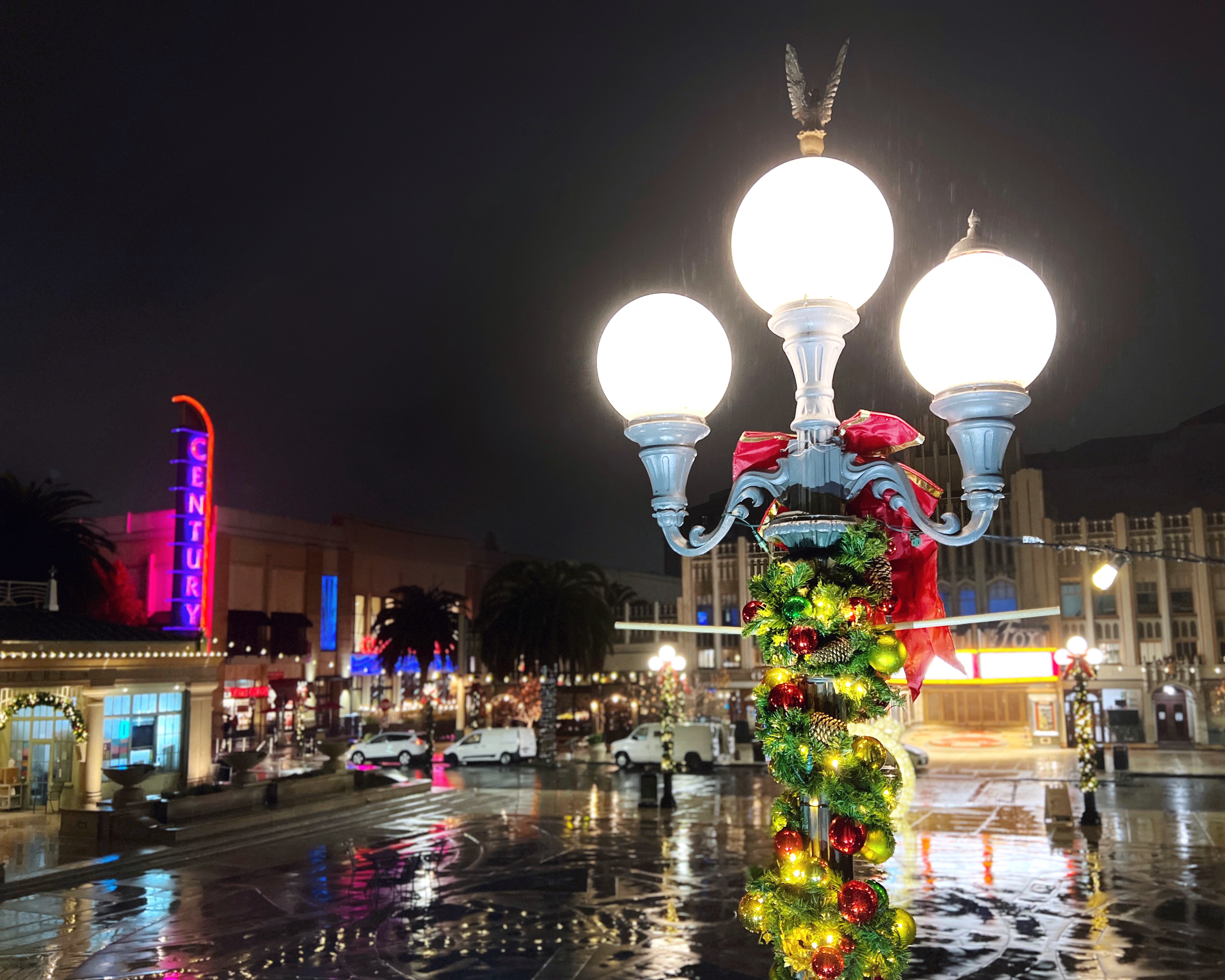 A street light in Redwood City, California is wrapped with garland and ornaments for the holiday season. 