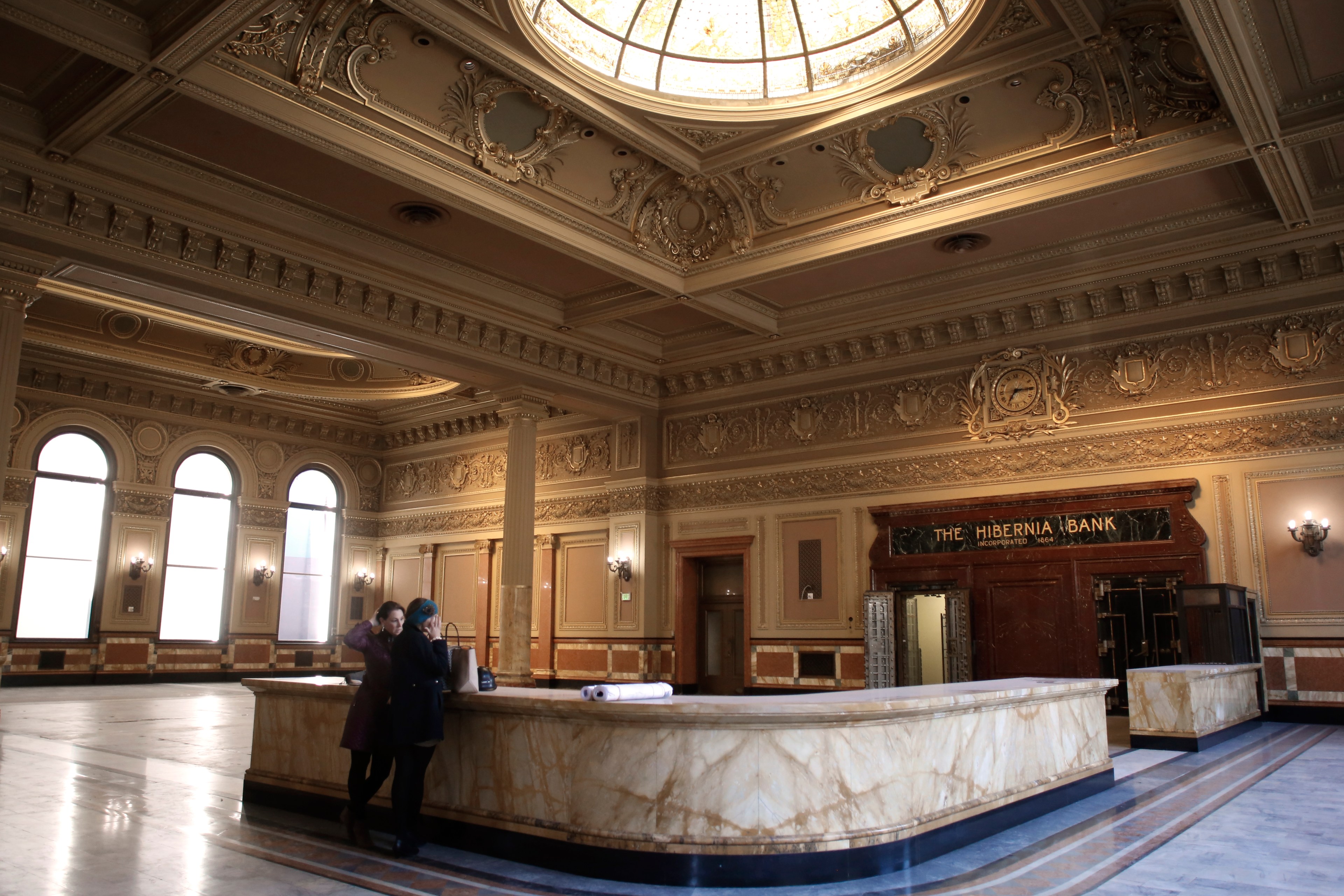 An old bank interior, empty, seen by day.