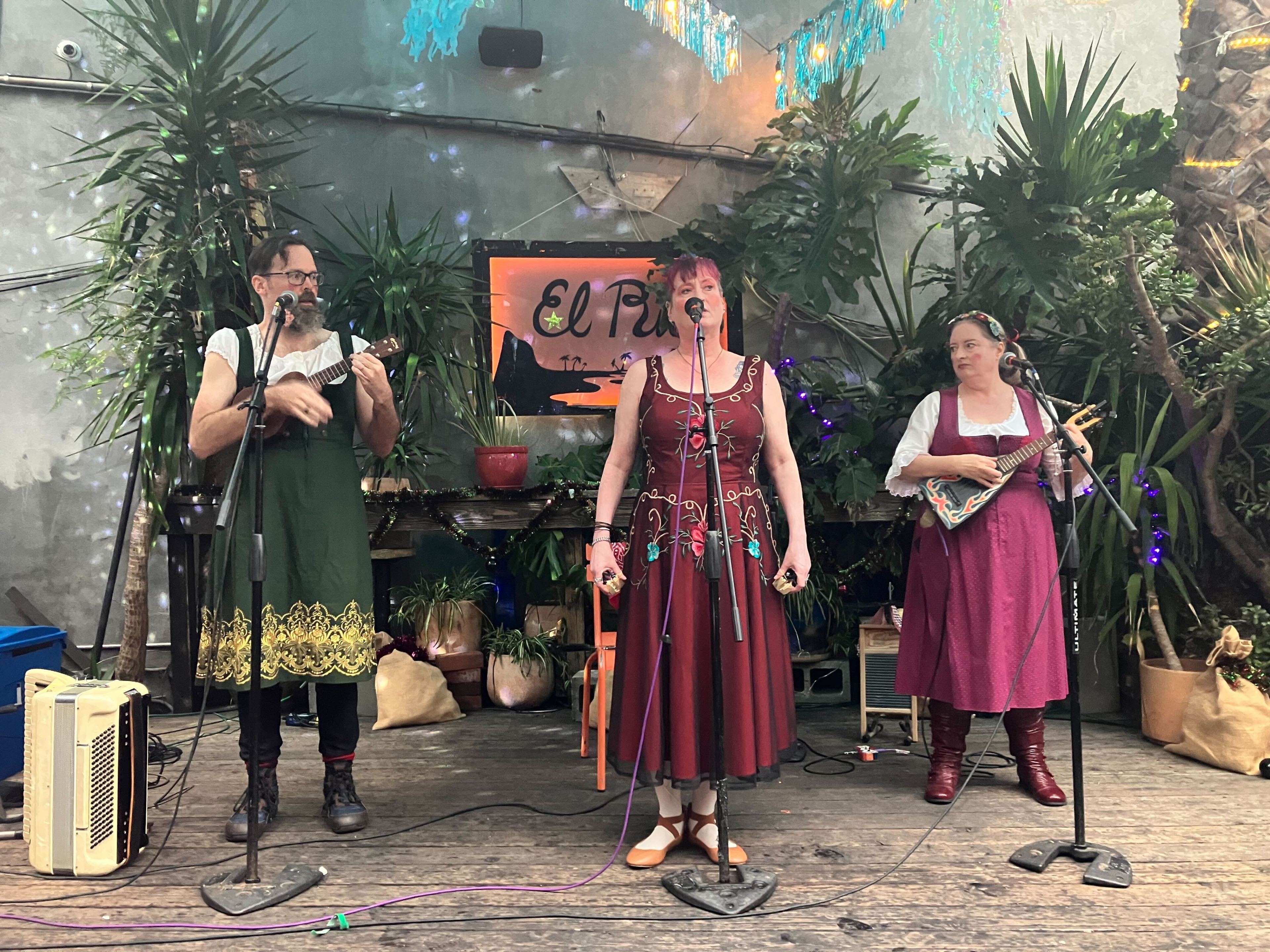 The string trio, 3 Drink Circus, performs to open the 5th annual Krampus Costume Pageant at the El Rio Bar in the Mission District on Saturday, Dec. 2, 2023.