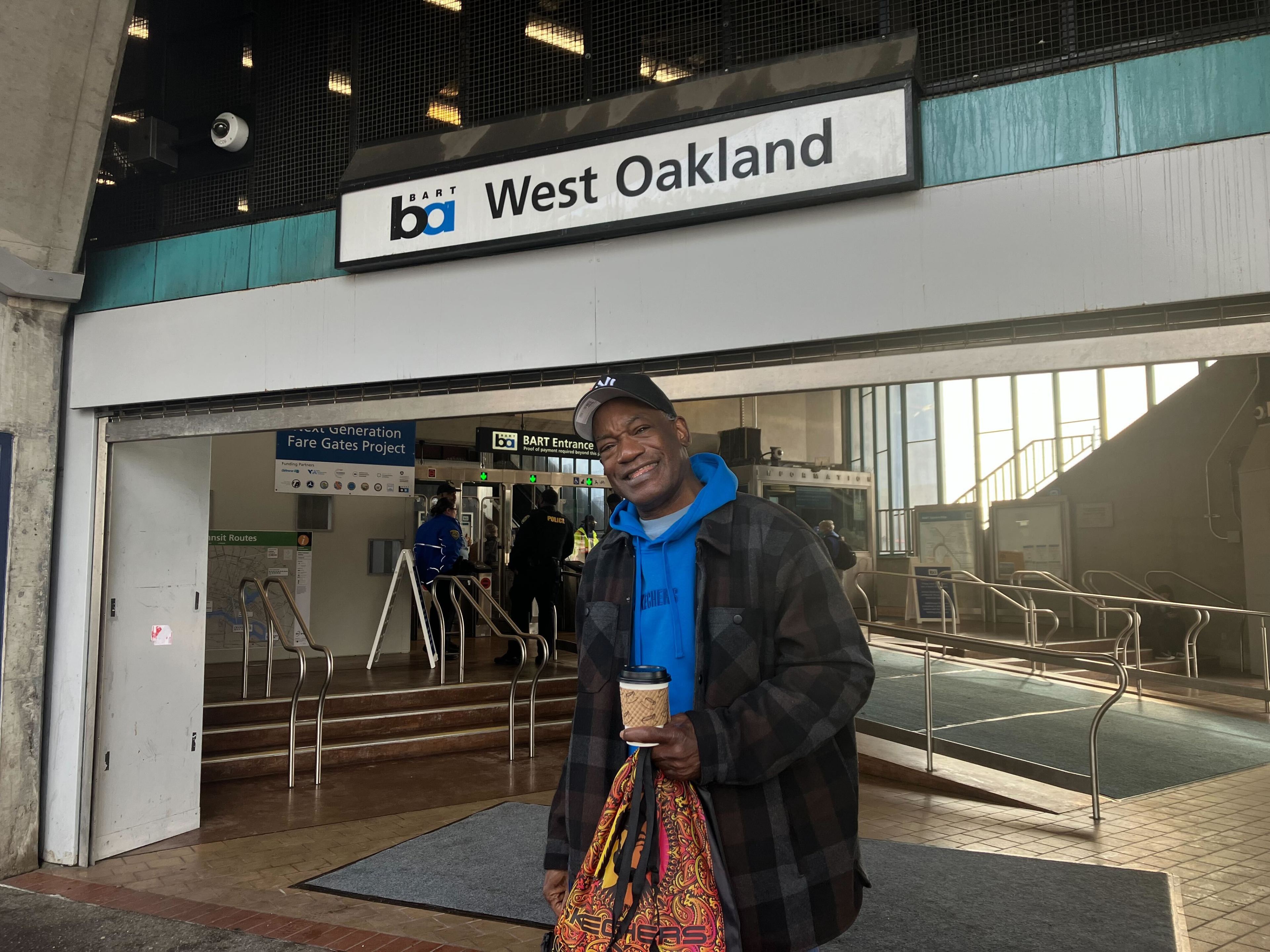 San Francisco resident Darryl Pace stands at the entrance of West Oakland Station on Dec. 28, 2023.