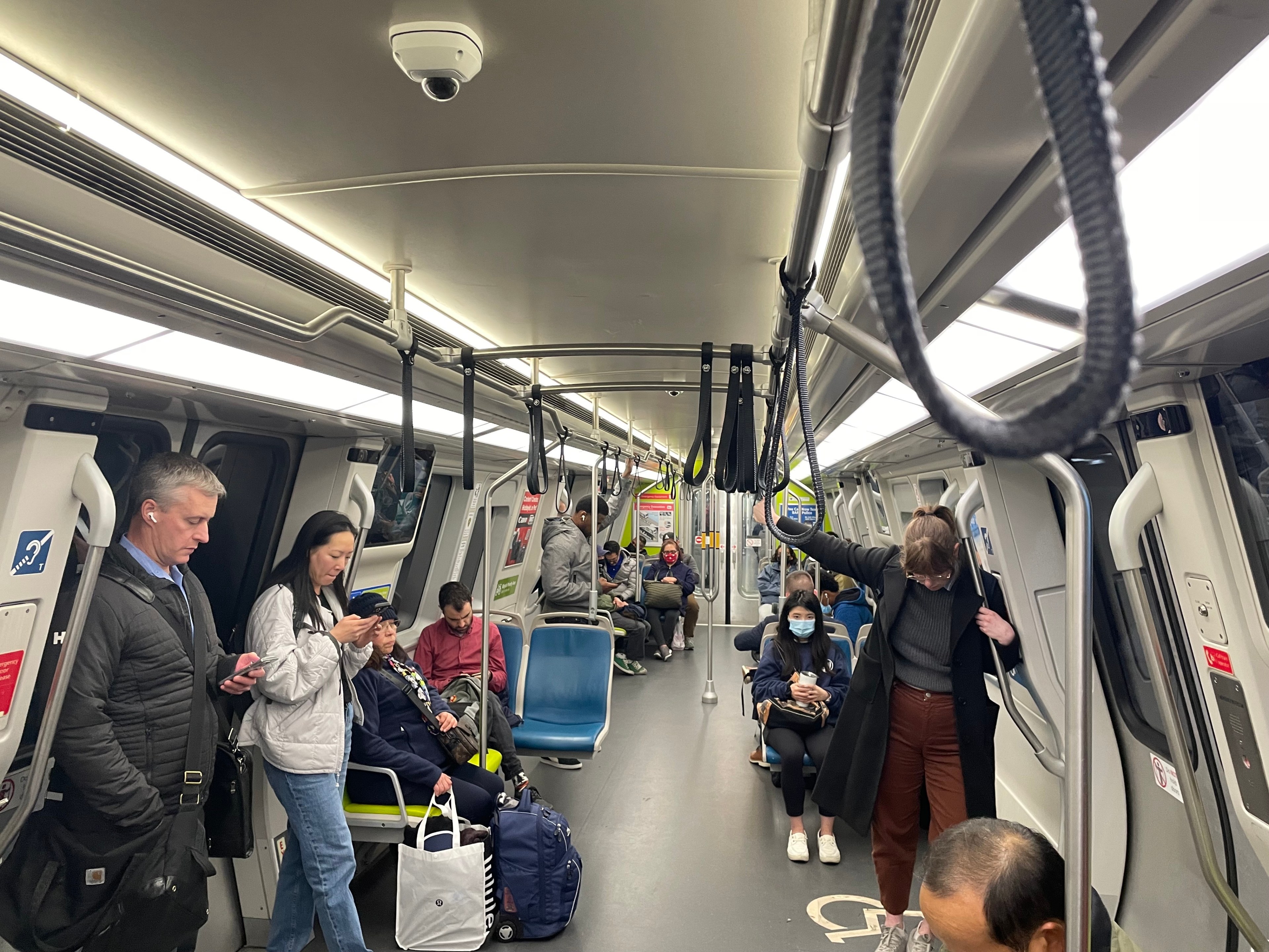 BART passengers ride a Blue line train heading from 12th Street station towards West Oakland station on Thursday.