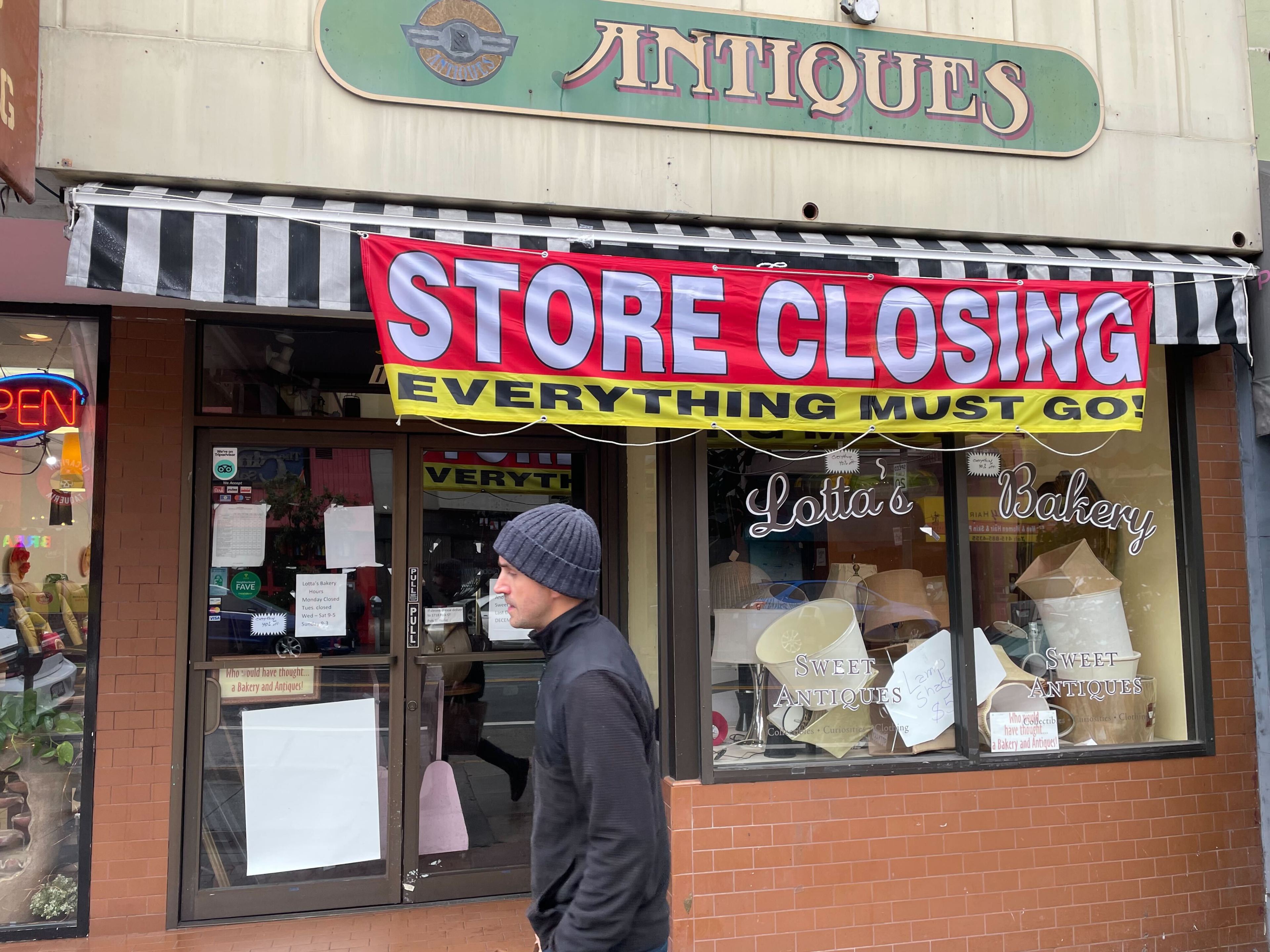 a store closing banner hangs outside a bakery