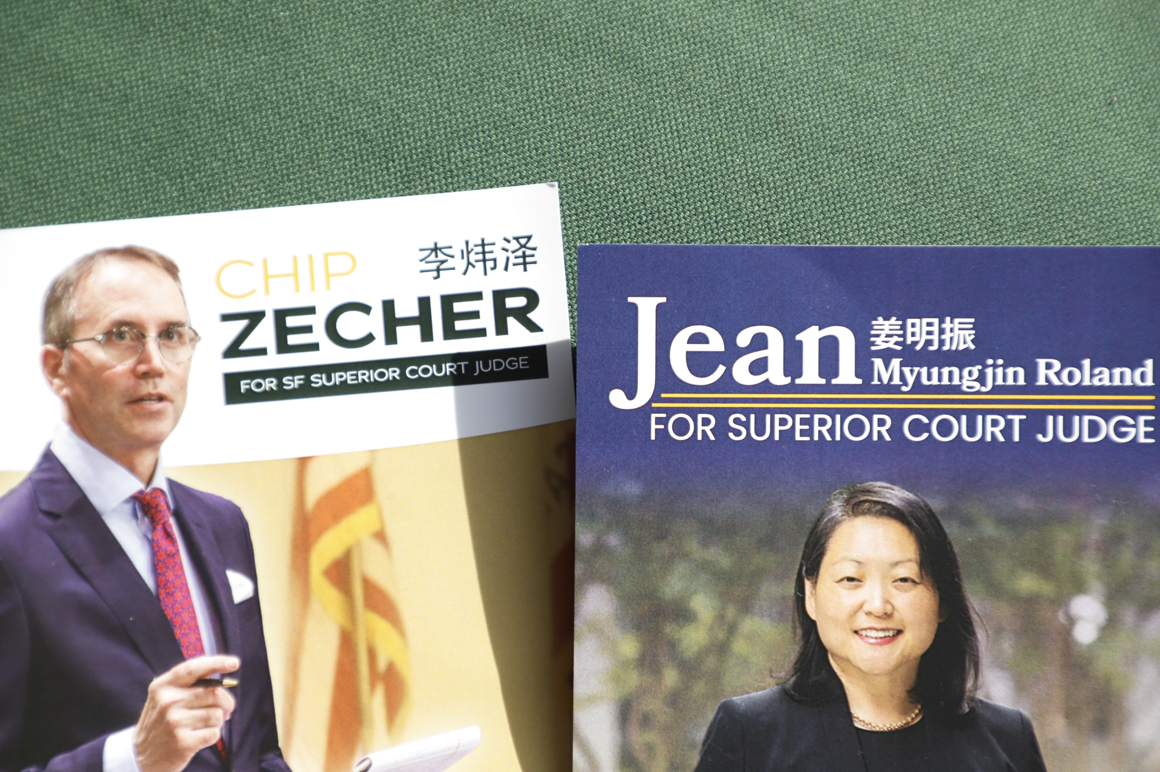 Campaign flyers for SF Superior Court judge candidates Chip Zecher, left, and Jean Myungin Roland have Chinese names next to their English names.