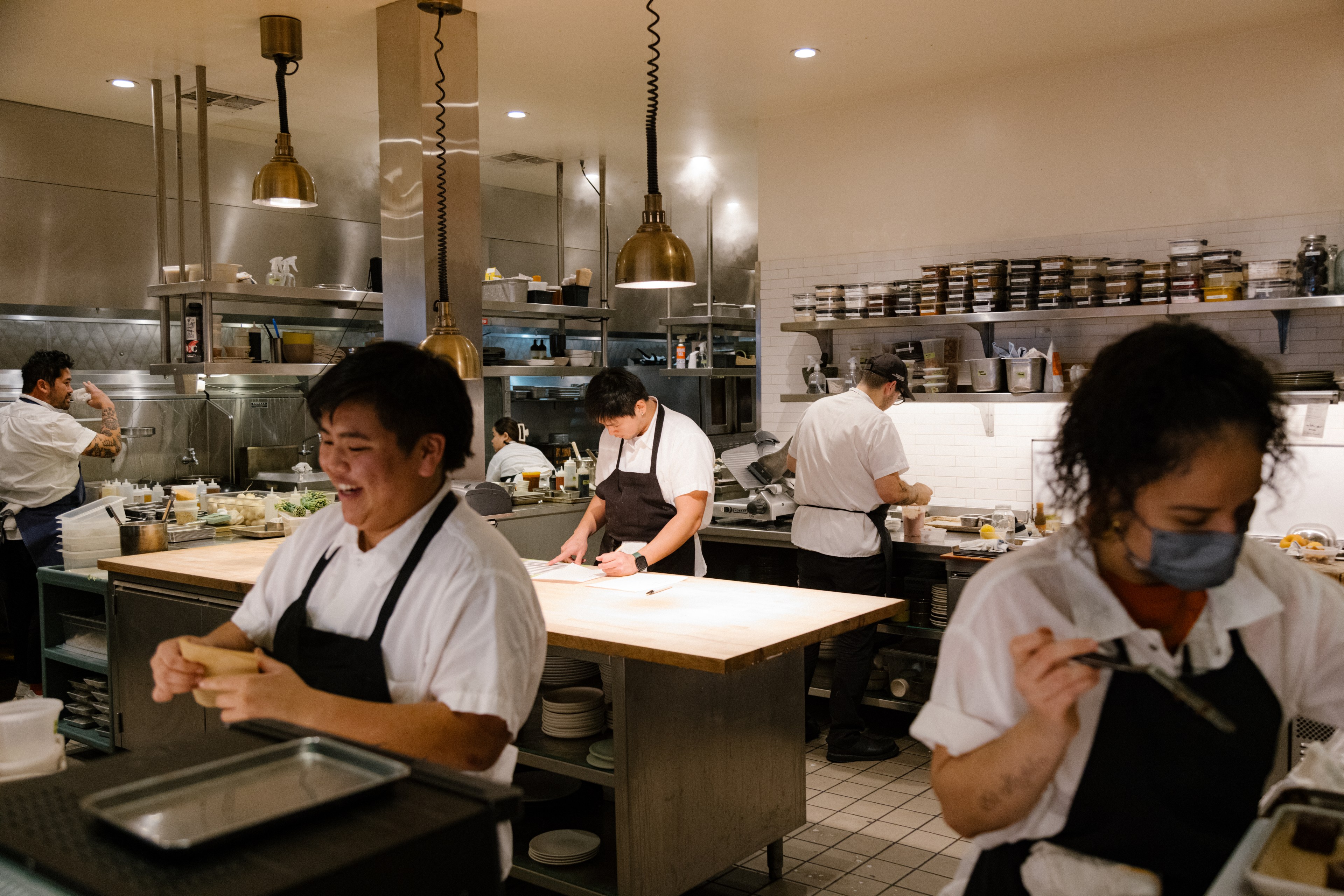 Kitchen staff preparing for service at Mister Jiu's restaurant in San Francisco