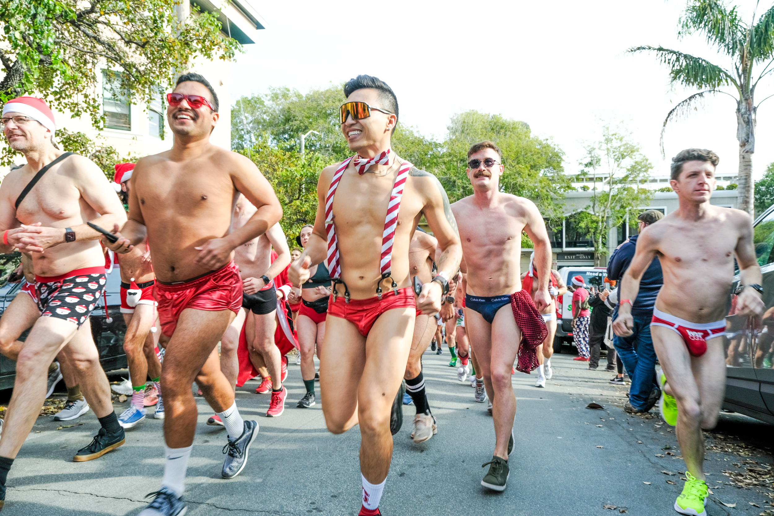 People dressed in underwear and Santa costumes rung across the street during a underwear fun run.