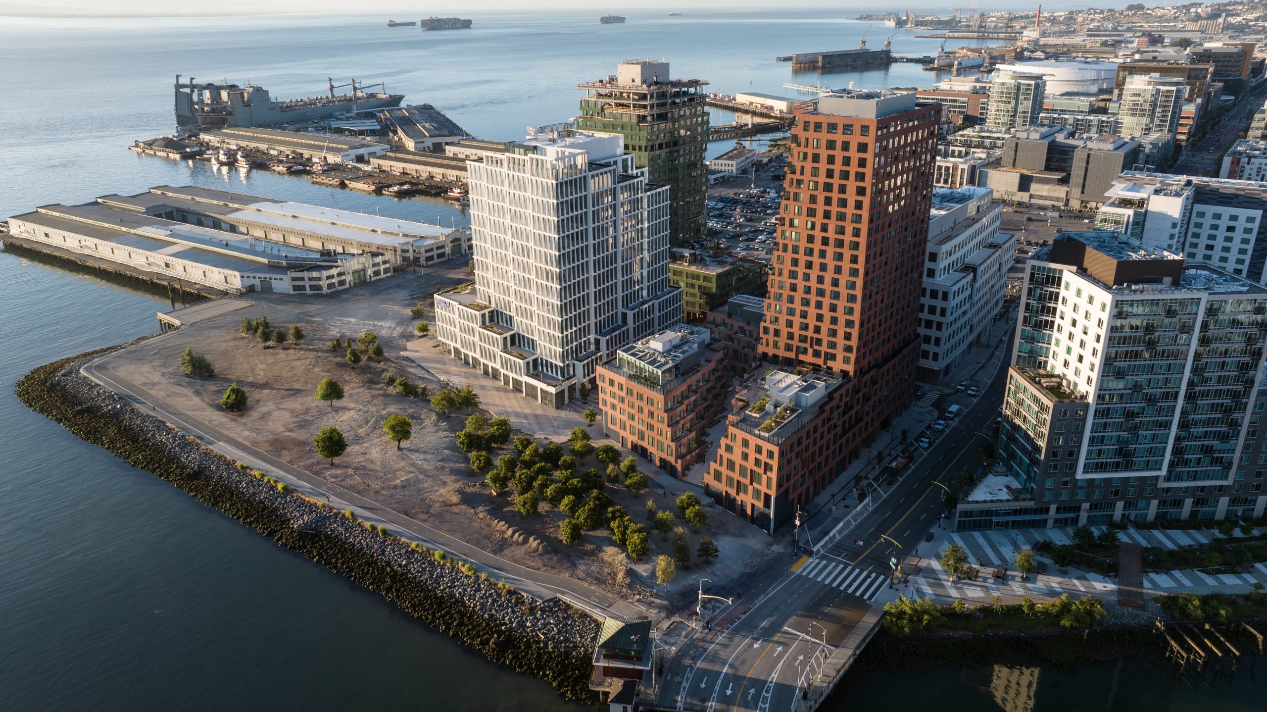 Rendering of three buildings next to each other on the waterfront