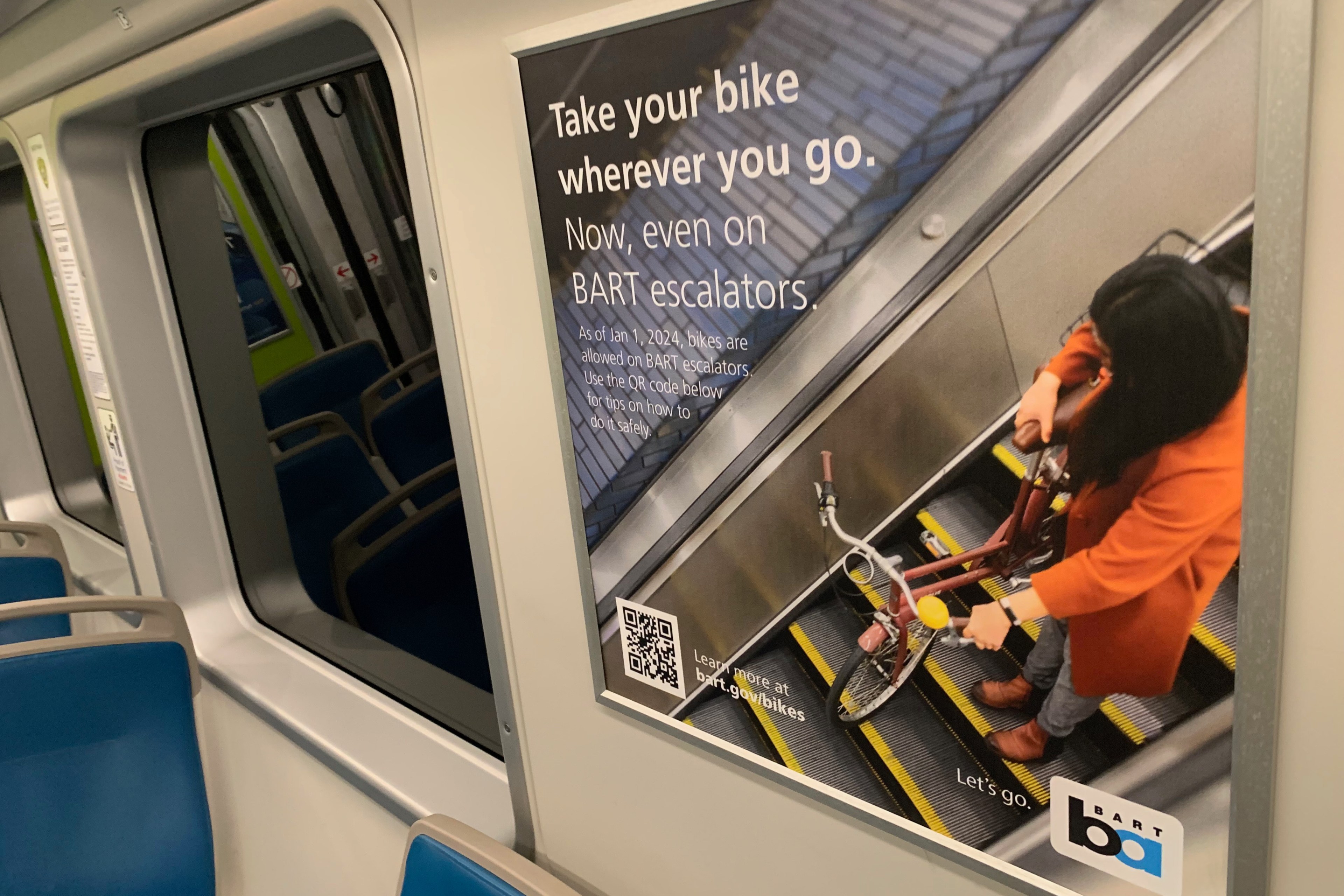 A BART public service announcement on a BART car on Tuesday, January 9, 2024 informing riders that bikes are permitted on escalators within BART stations. At the beginning of 2024, BART has allowed riders take their bicycles, scooters, etc. on escalators.