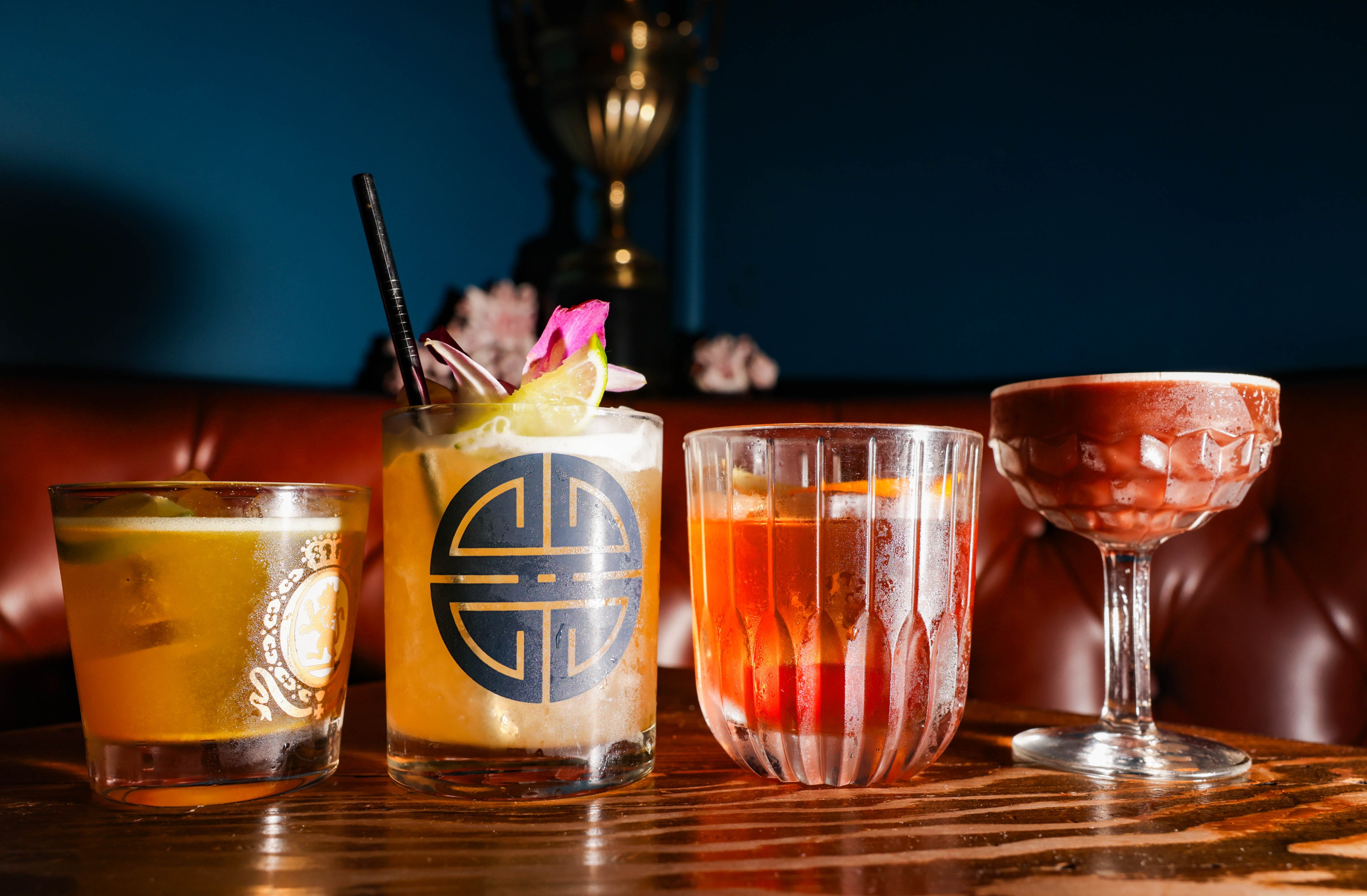 an array of four fancy cocktails