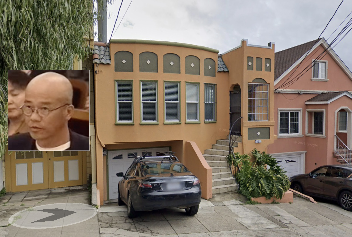 A picture of a house with a man's head nearby.