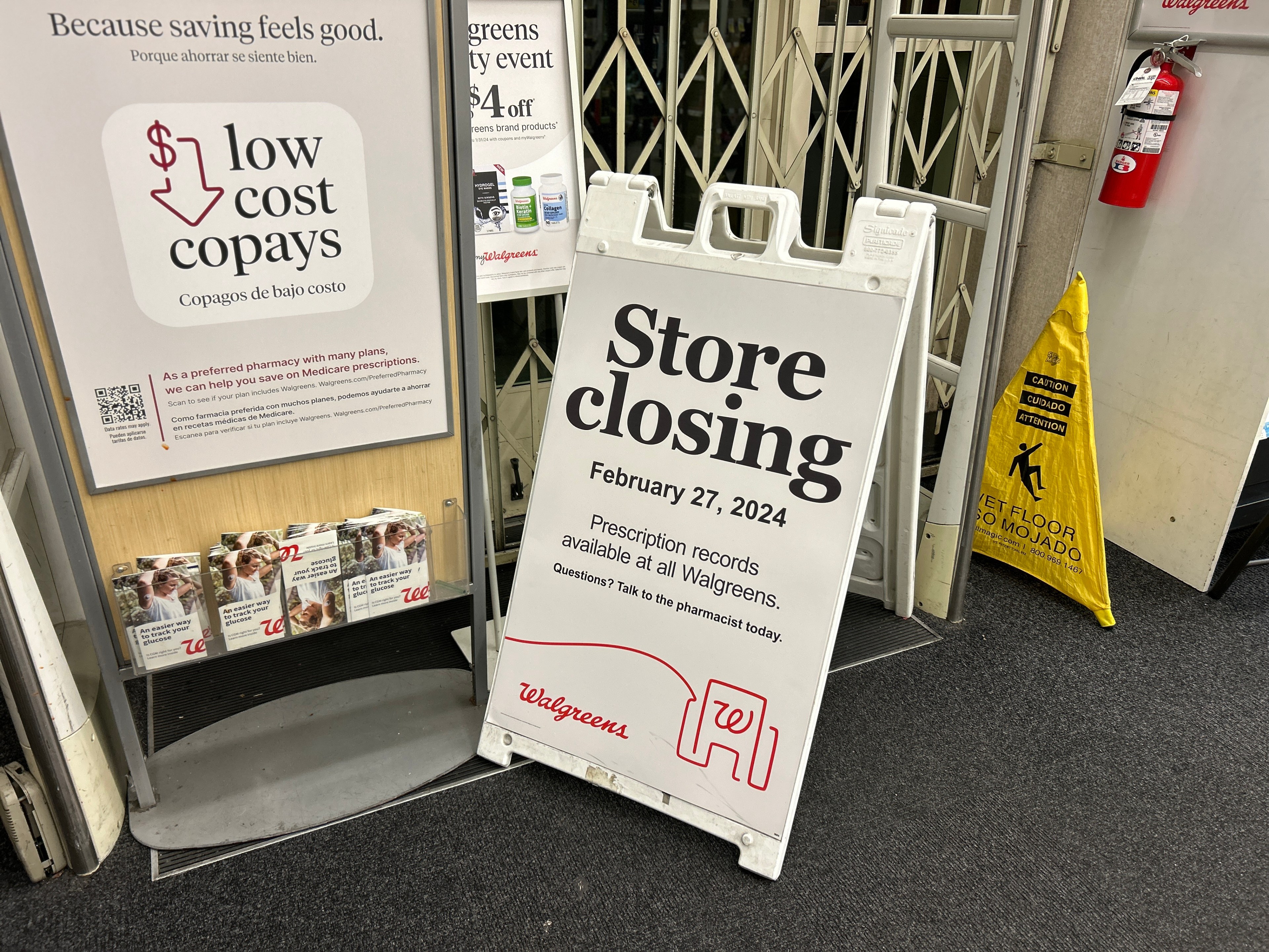 A sandwich board announces the impending closure of a Walgreens.
