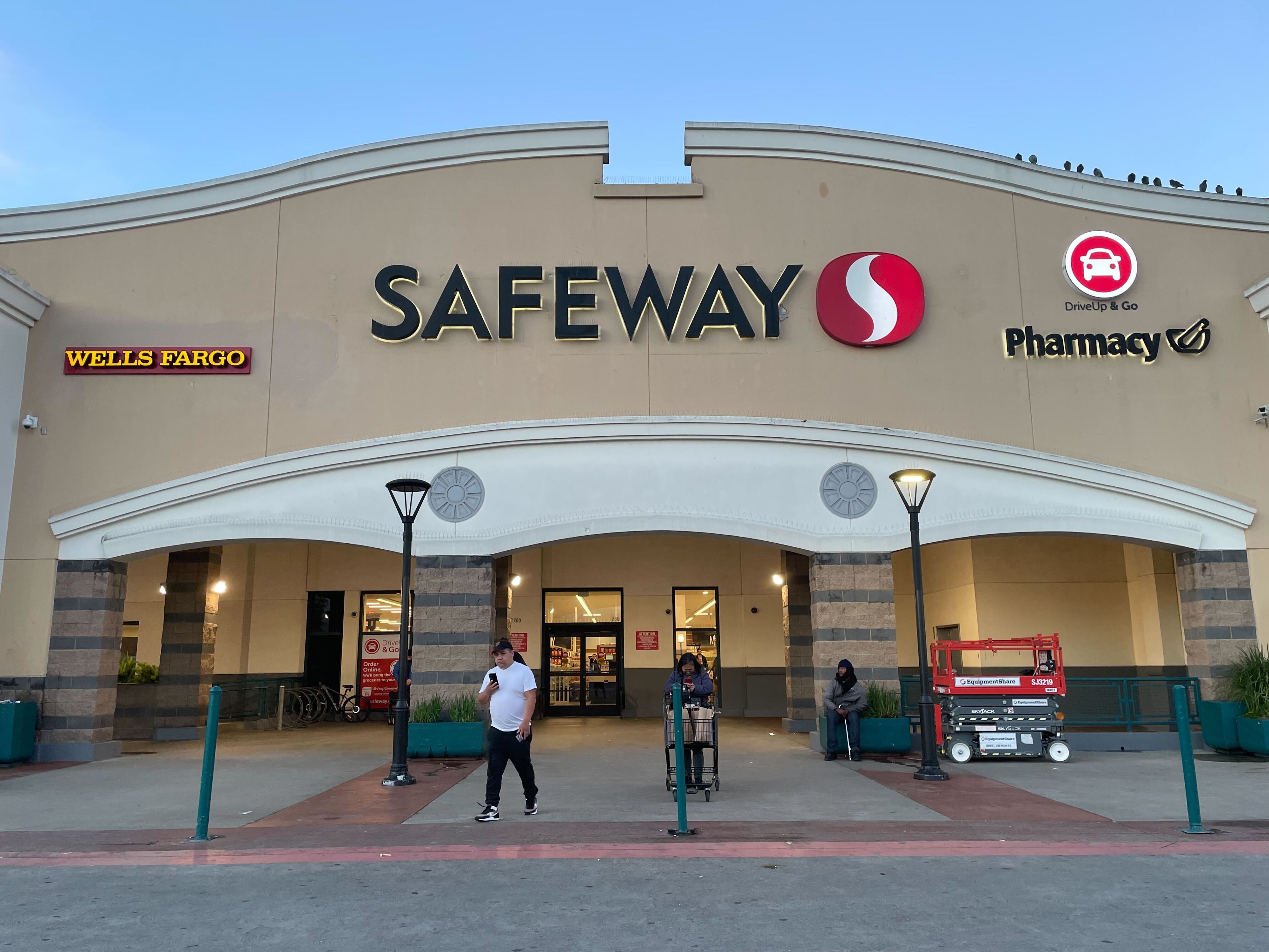 People walk in front of a Safeway in San Francisco.
