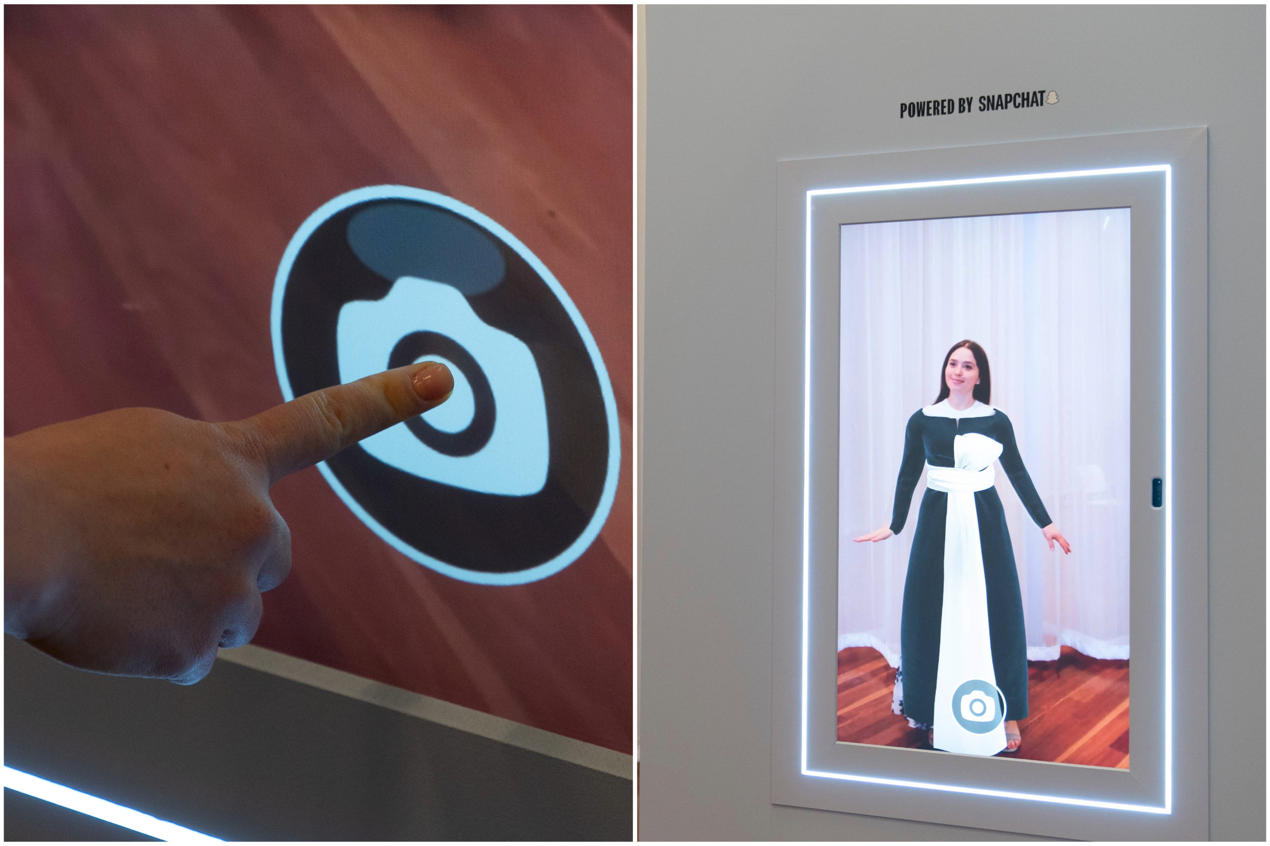 A person presses a button with a camera icon on it next to a screen of a woman dressed in a fancy gown.