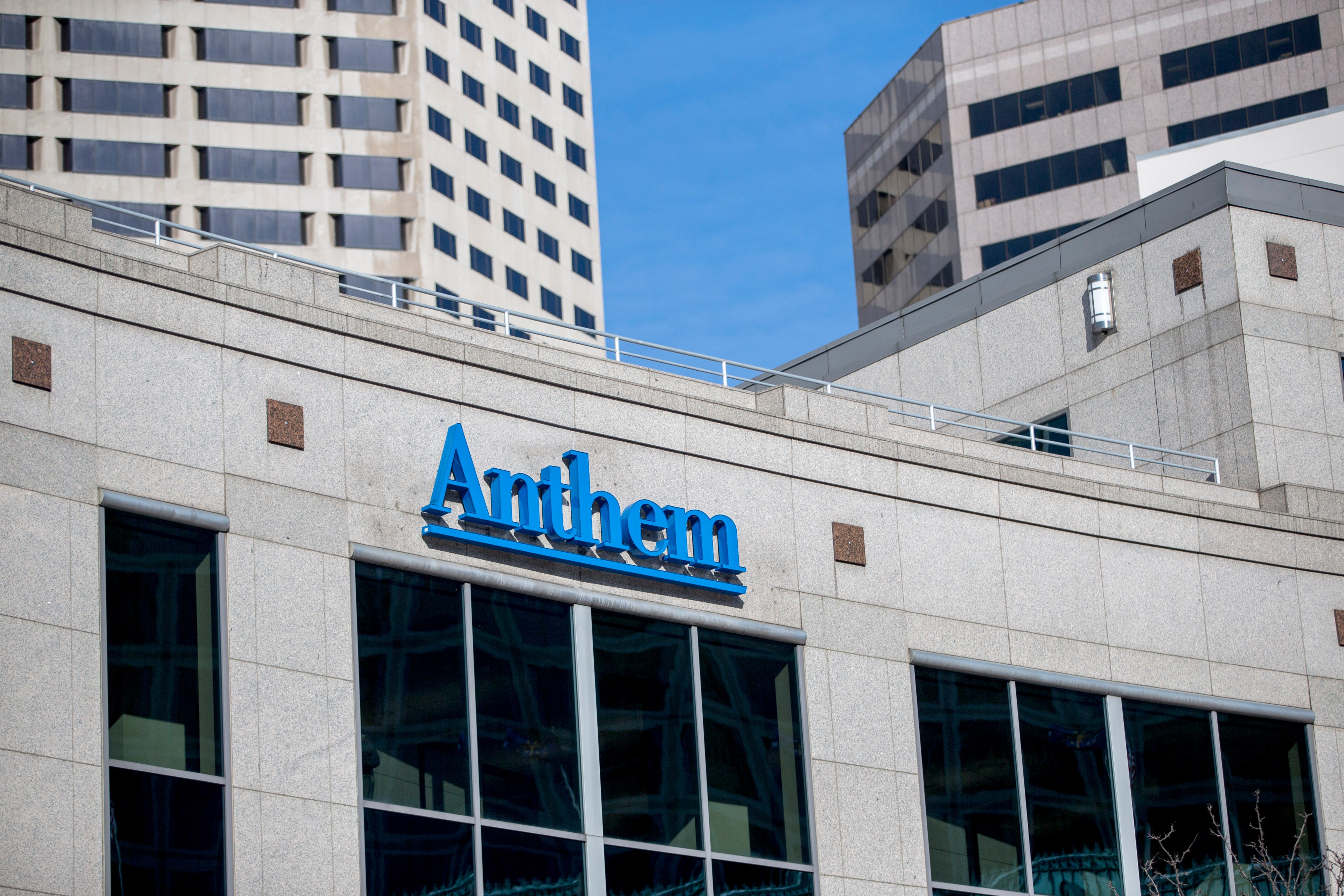 A building exterior with a blue sign for Anthem Blue Cross