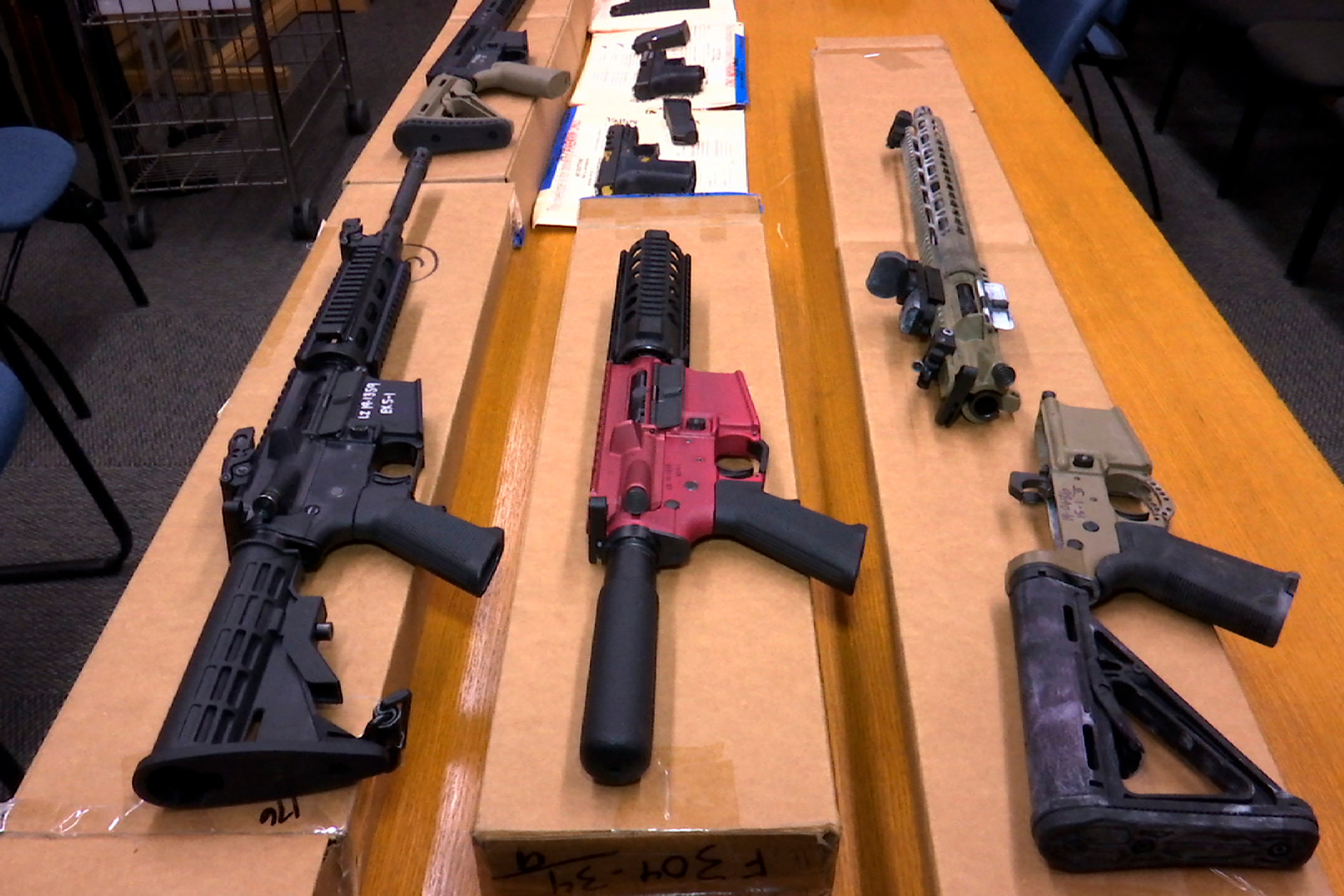 A group of ghost guns on a table.
