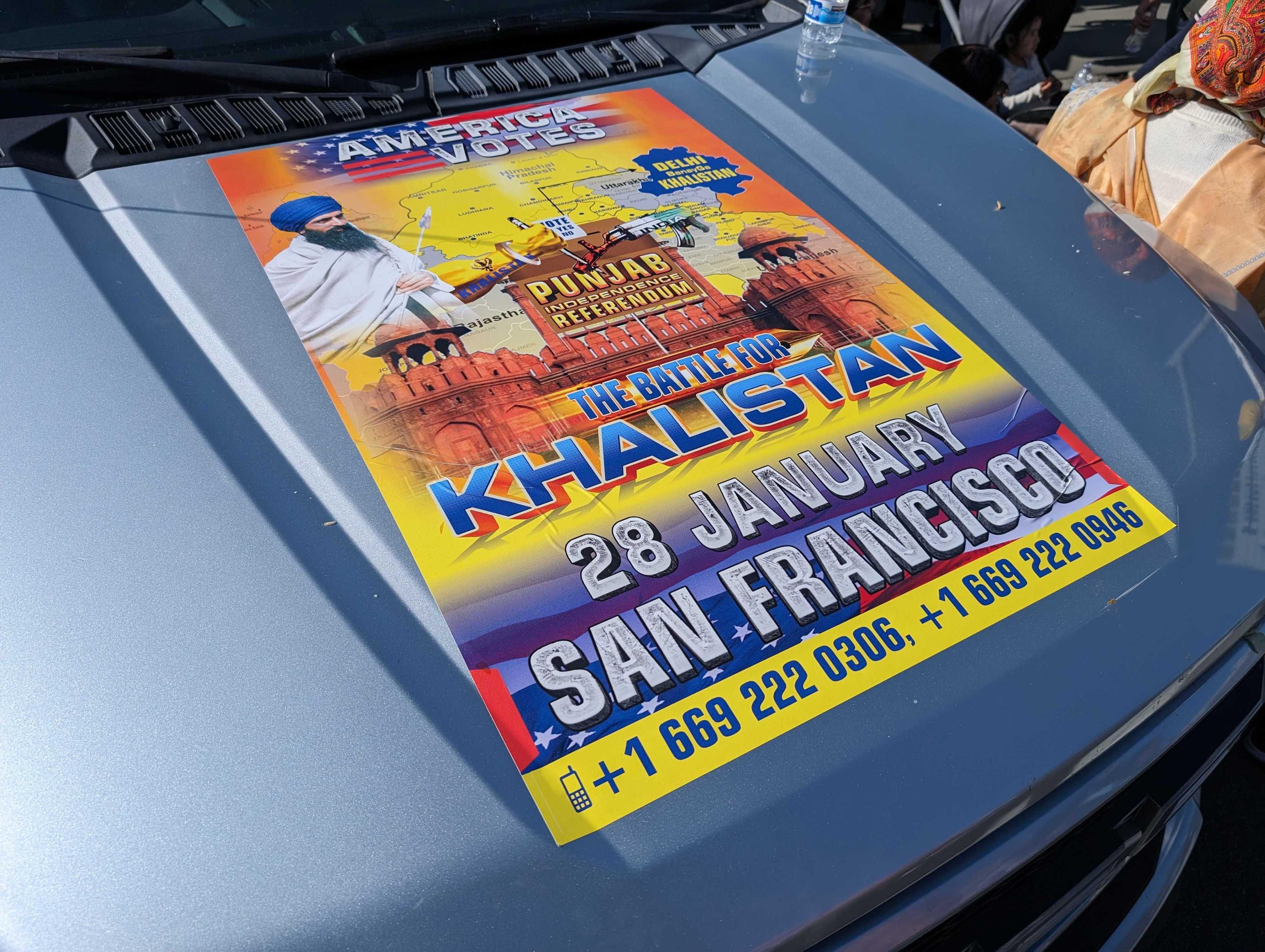 A vinyl decal atop a vehicle's hood advertises a Punjab independence referendum