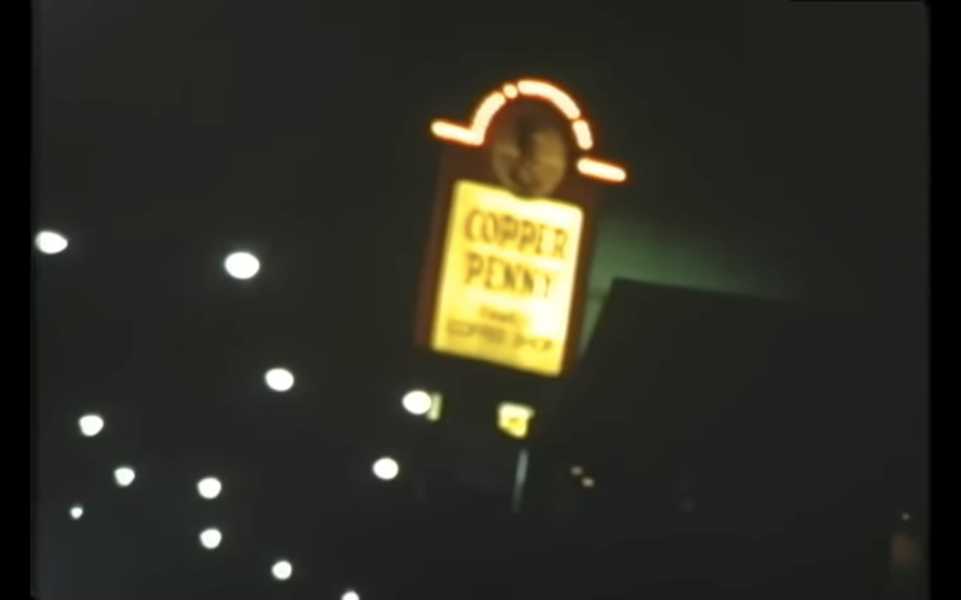 A glowing sign reads &quot;COPPER PENNY.&quot;
