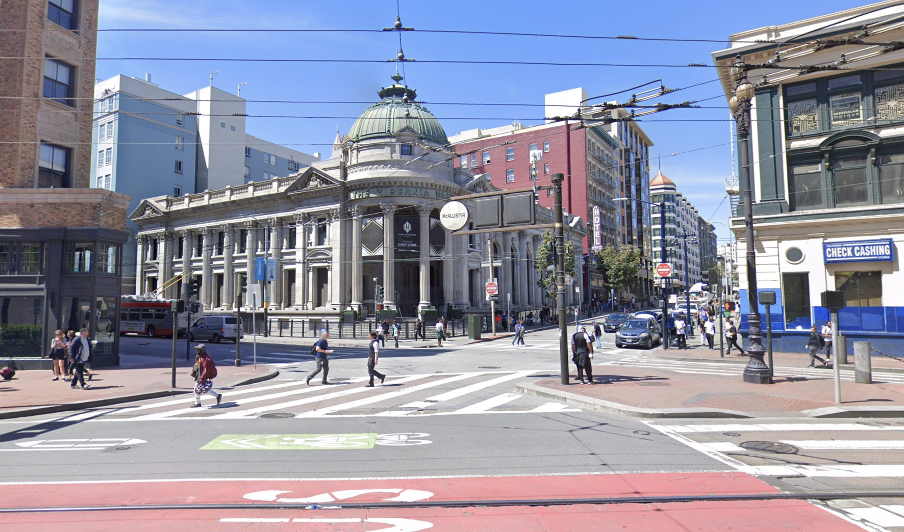 A city intersection is shown in a photo.