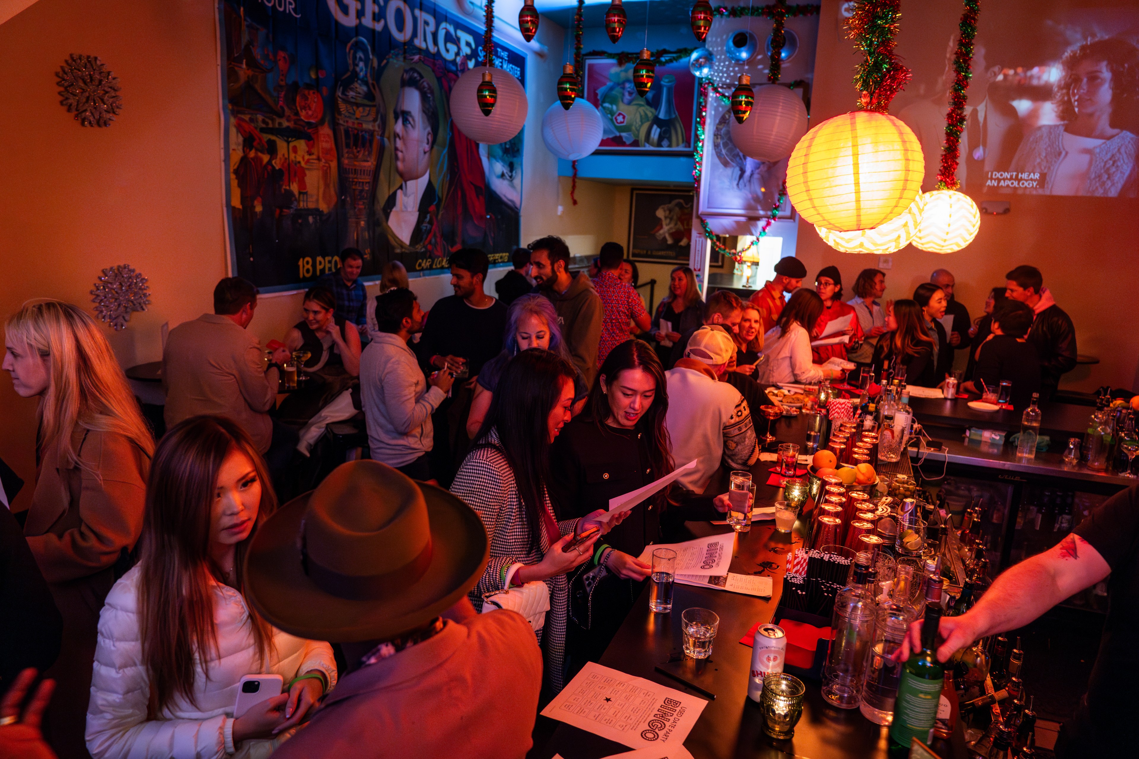People gather in a bar for a singles mixer.