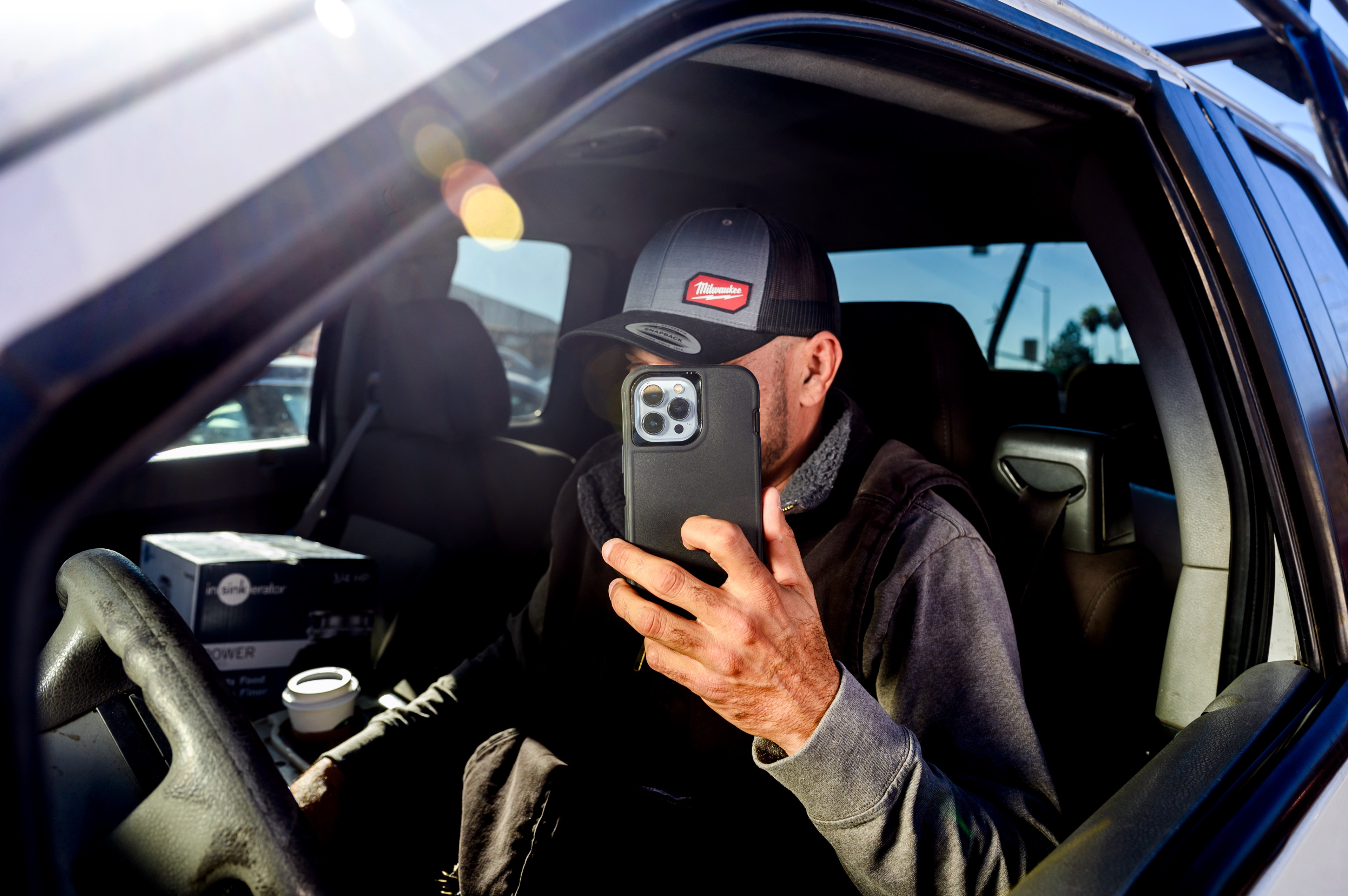 Gregorio Ramon, whose social media posts about Oakland life have been gaining followers, sits for a portrait inside his pickup truck on Saturday, Feb. 10, 2024, in Oakland.