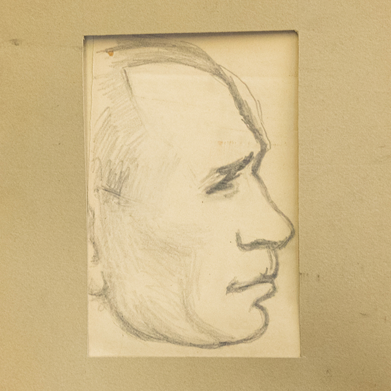 A sketch of a man's profile on aged paper, featuring distinct, sharp pencil lines.