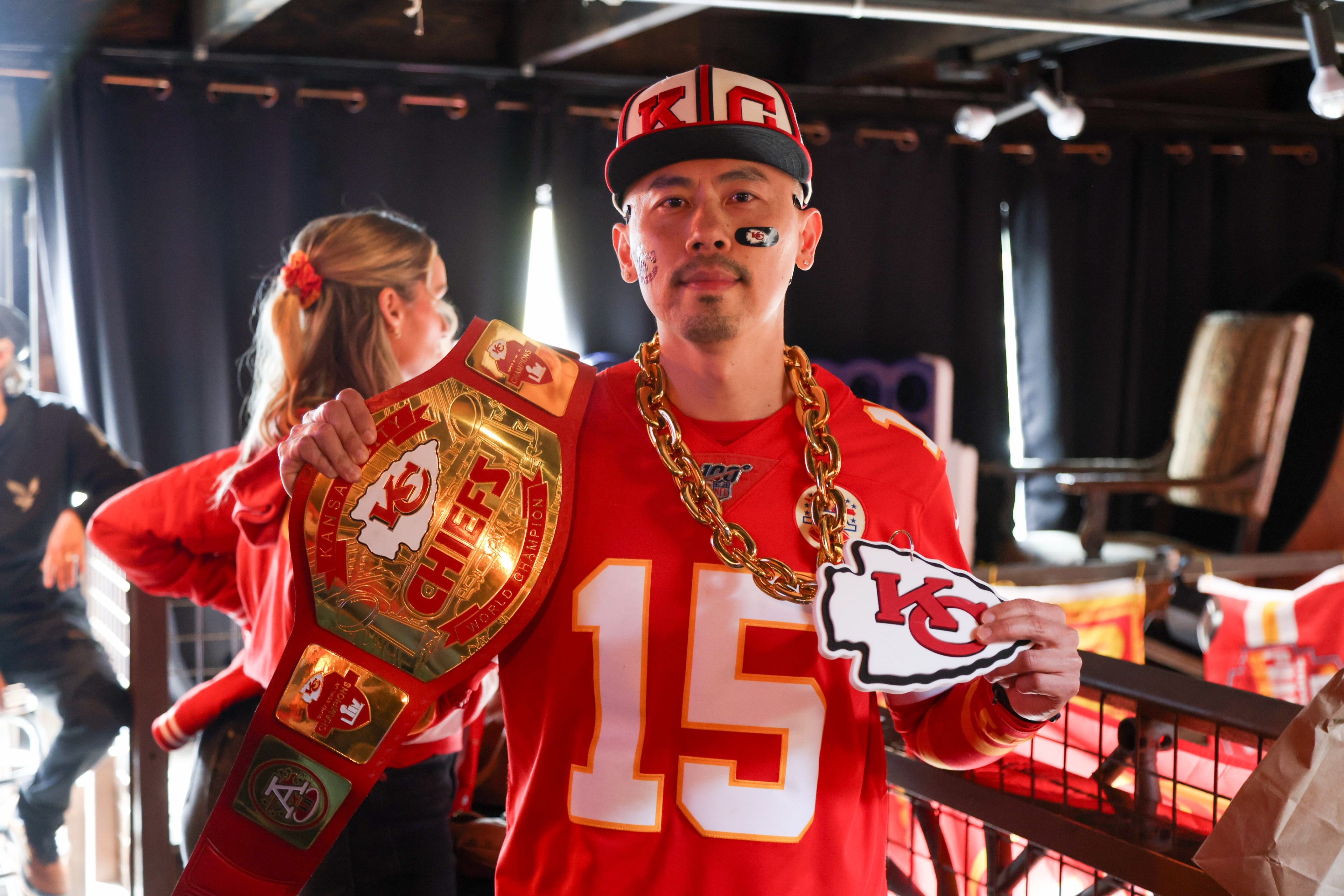 Kansas City Chiefs fan shows off belt and necklace