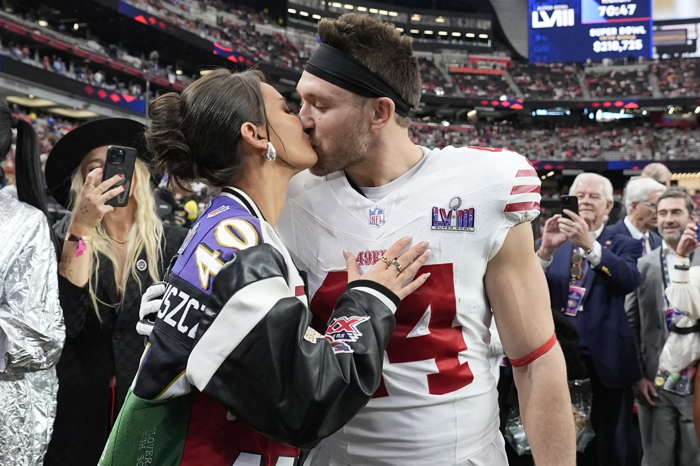 San Francisco 49ers fullback Kyle Juszczyk kisses his wife Kristin Juszczyk before the NFL Super Bowl 58 football game against the Kansas City Chiefs, Sunday, Feb. 11, 2024, in Las Vegas.
