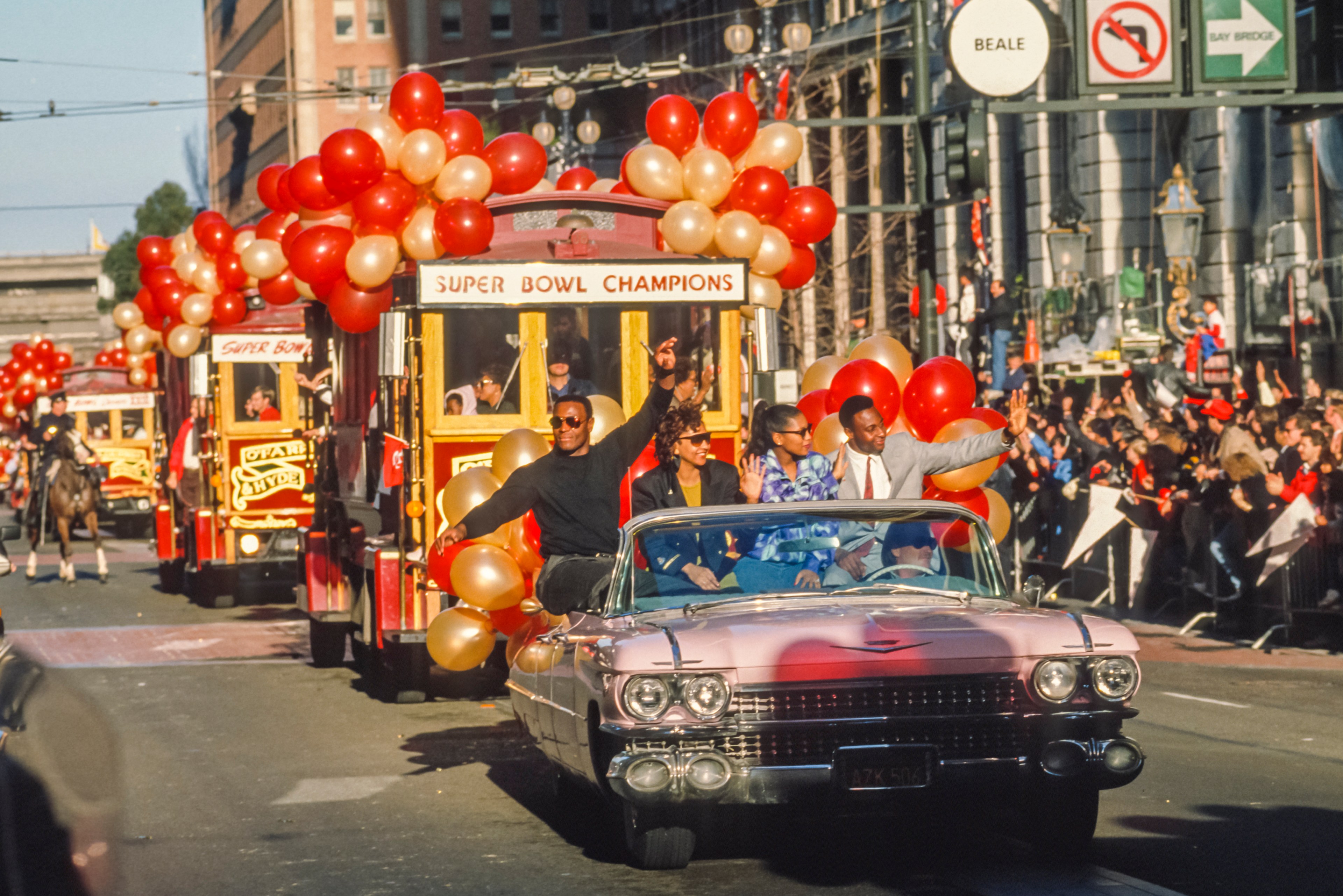 San Francisco 49ers players Roger Craig, left, Vernessia Craig, center left, Jacqueline Rice, center right, and Jerry Rice ride in the Super Bowl Champion parade down Market Street in San Francisco on Jan. 24, 1989 following the 49ers Super Bowl XXIII victory over the Cincinnati Bengals.
