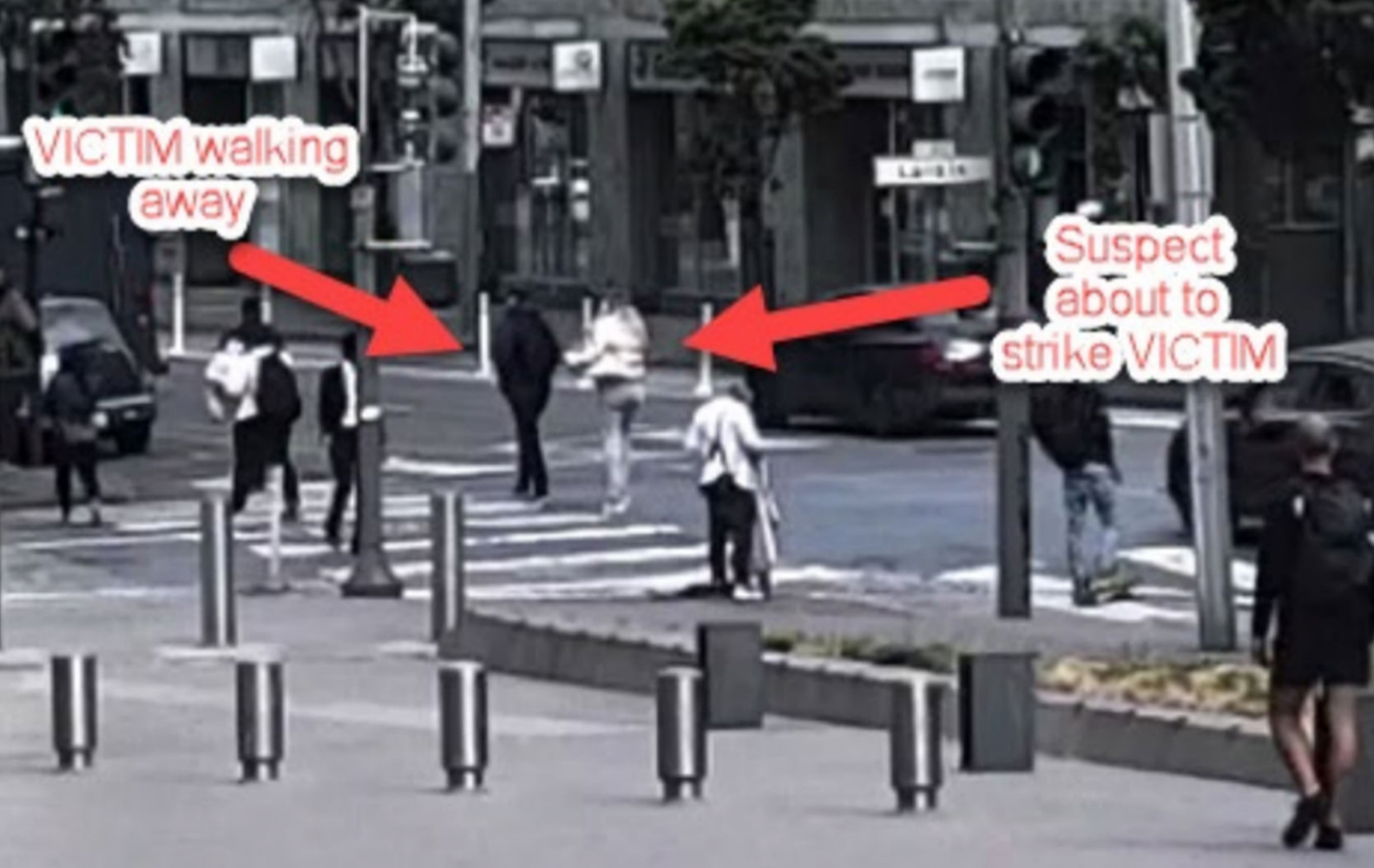 A video image of a woman walking on the street.