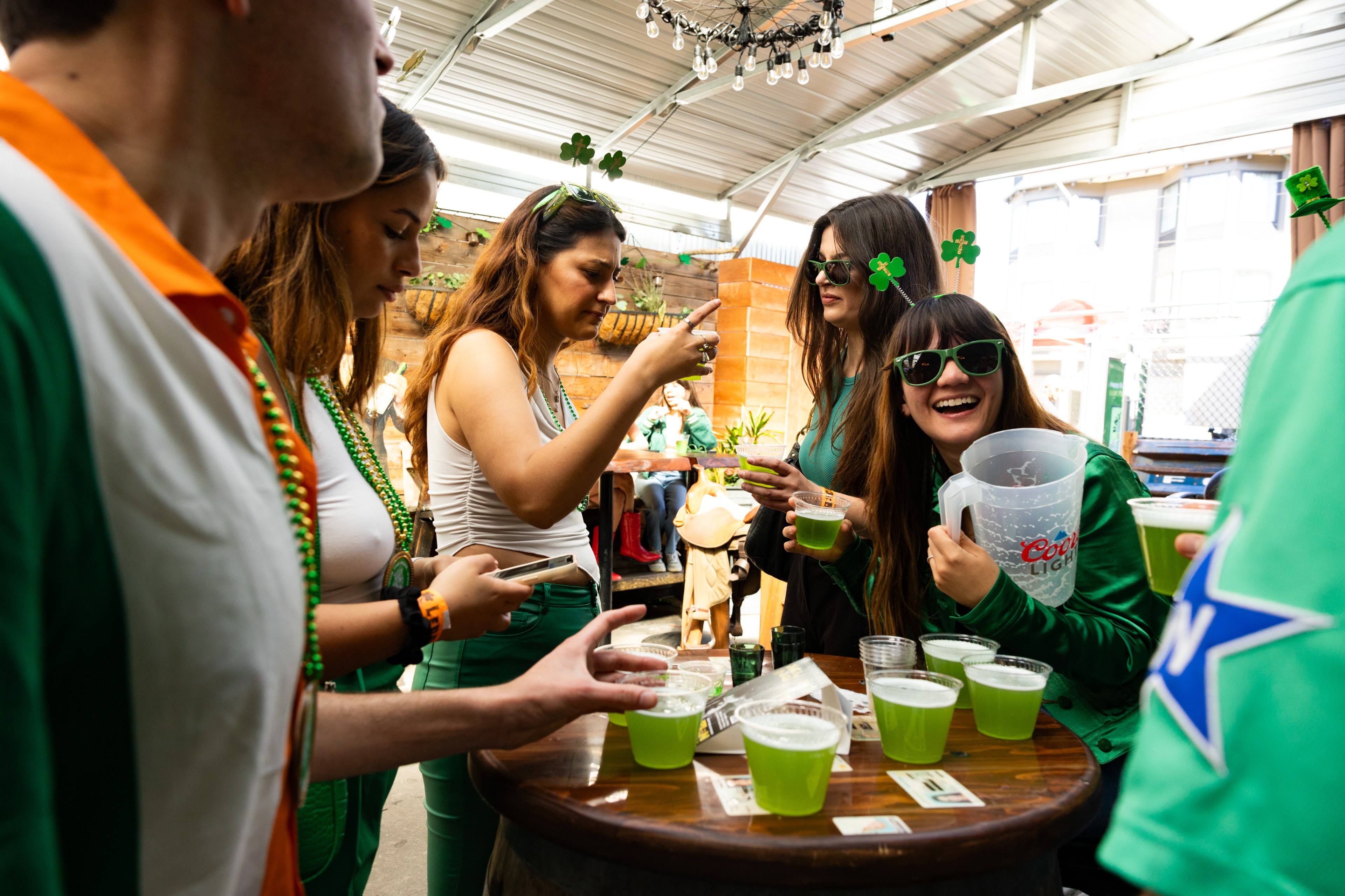 Revelers at St. Patrick's Day pub crawl