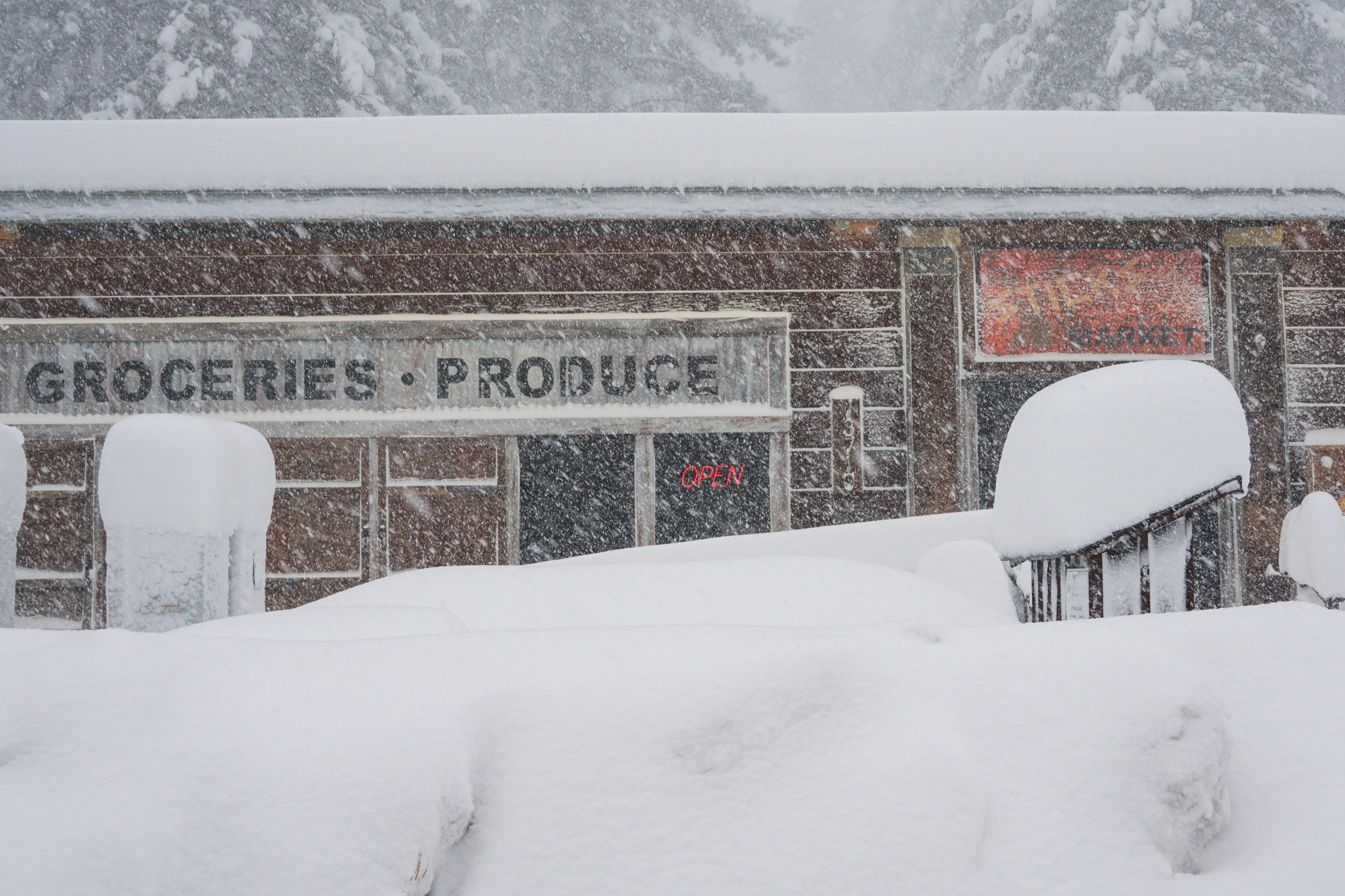 Snow piles up in front of market storefront