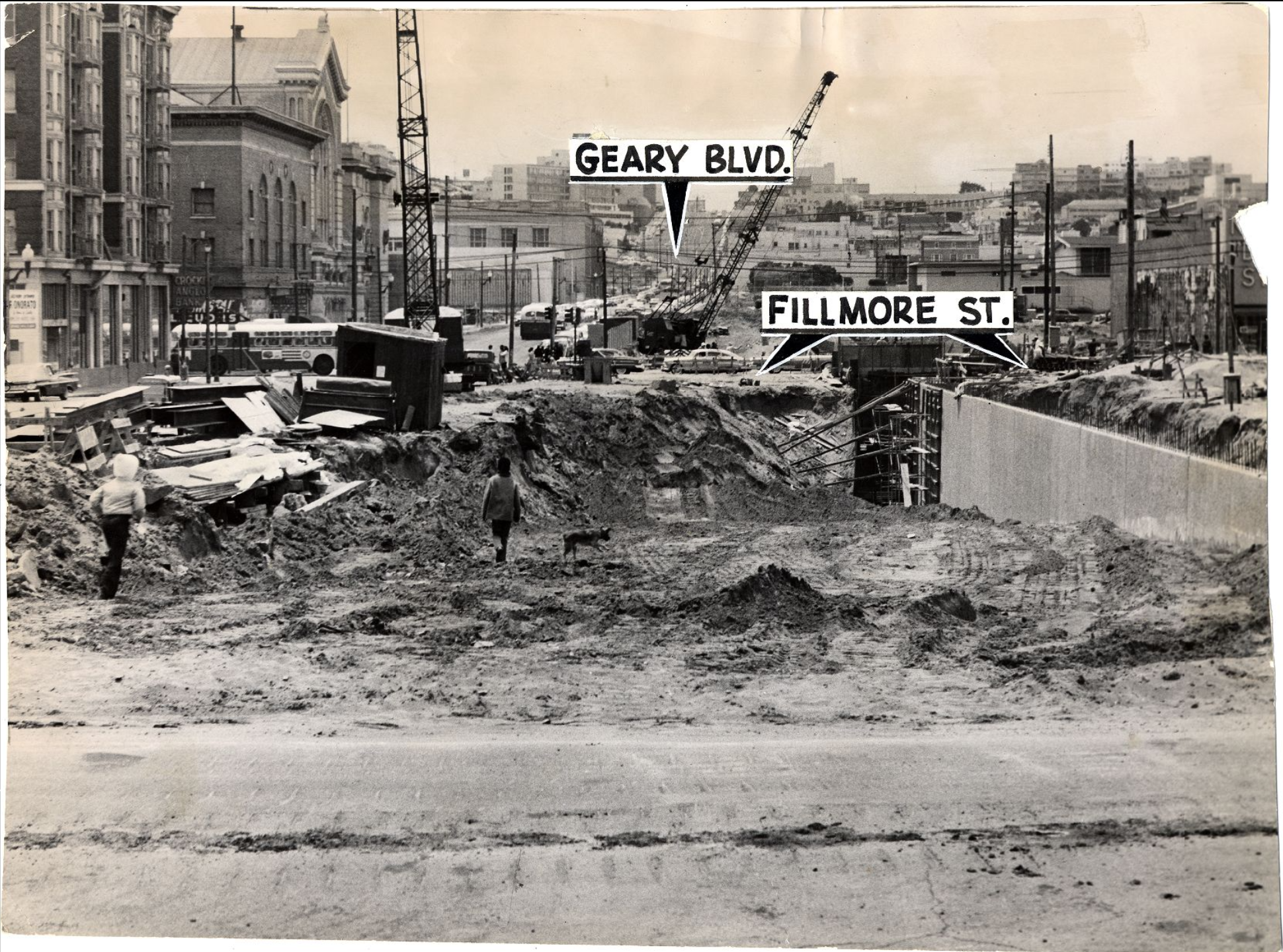 A black and white photo of an urban construction site with labeled streets, cranes, two people, and debris.