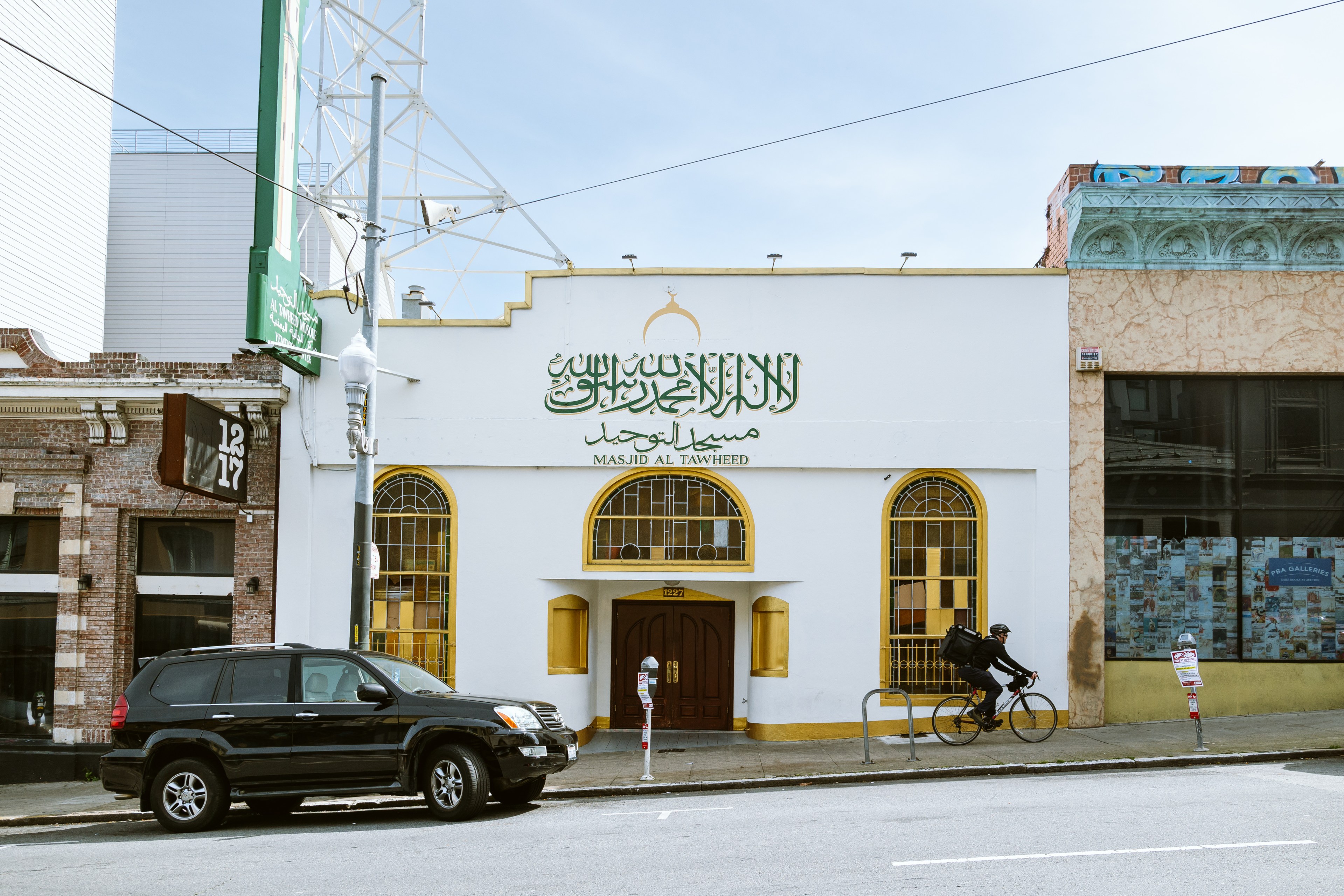 Cyclist passes the Masjid Al-Tawheed Mosque at 1227 Sutter Street in San Francisco on Wednesday.