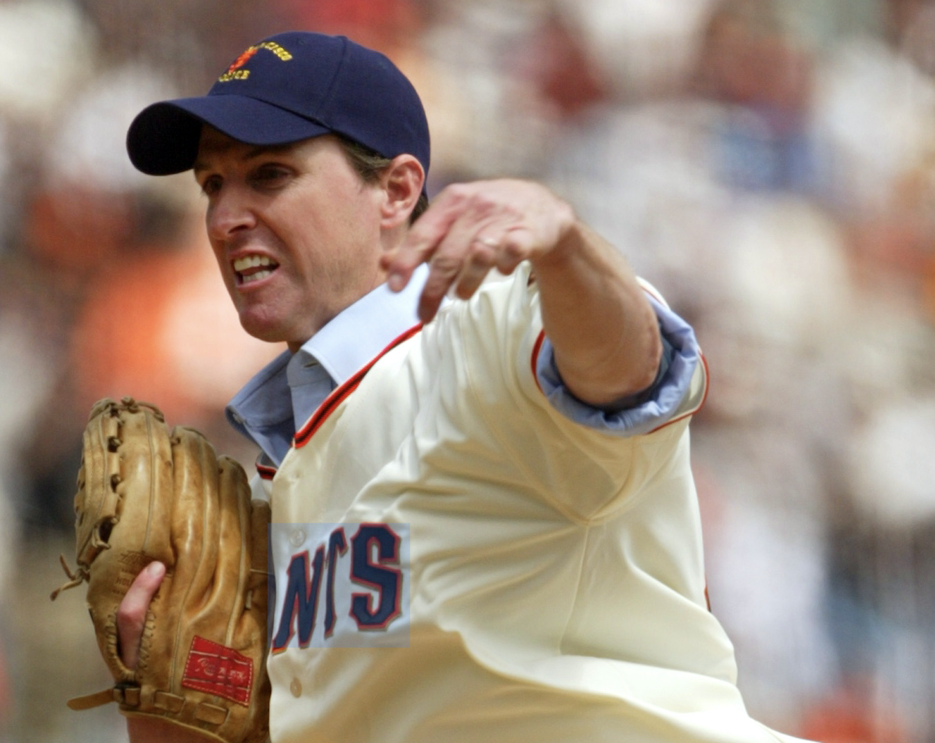 Gavin Newsom throwing a baseball