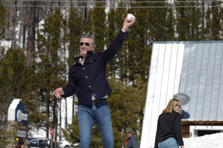Gavin Newsom throwing a snowball