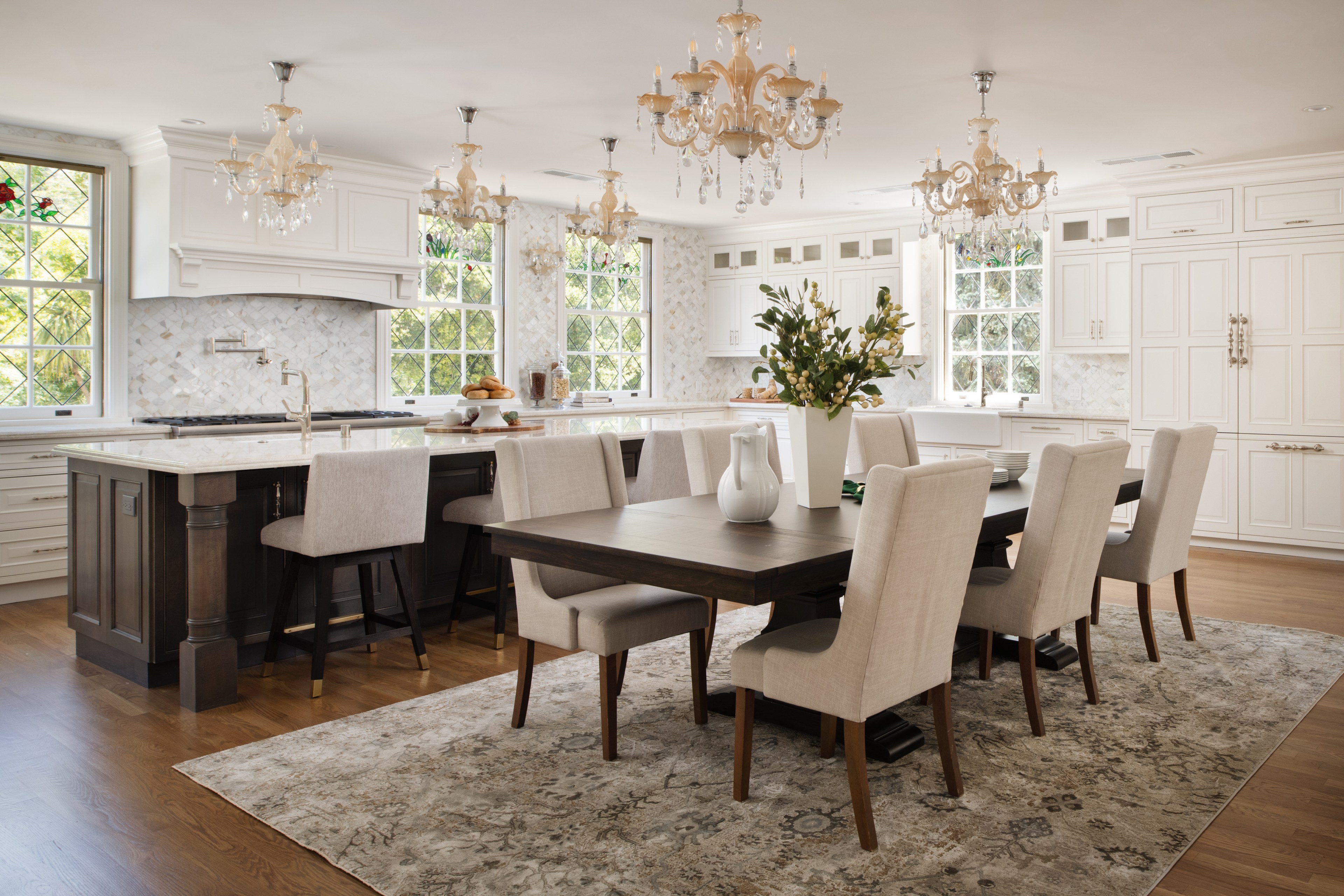 Fancy chandeliers, deep cabinets and a marble-topped island adorn a kitchen within the 'Western White House'