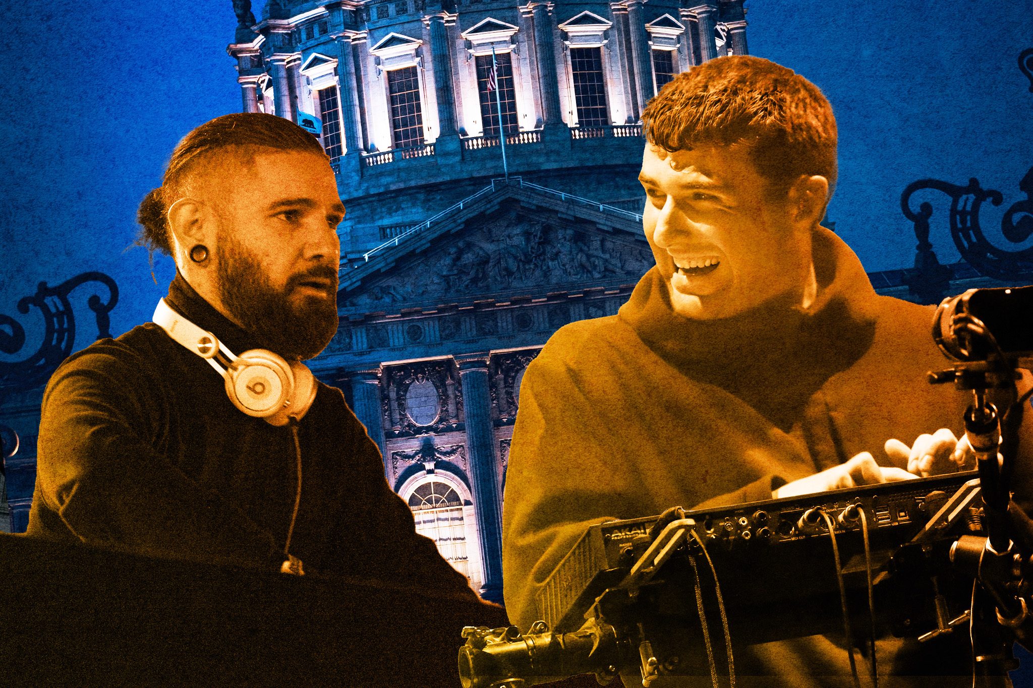 Two men are in the foreground; one with a beard and headphones, focused, and the other is smiling at a keyboard. A large, ornate building is illuminated behind them.