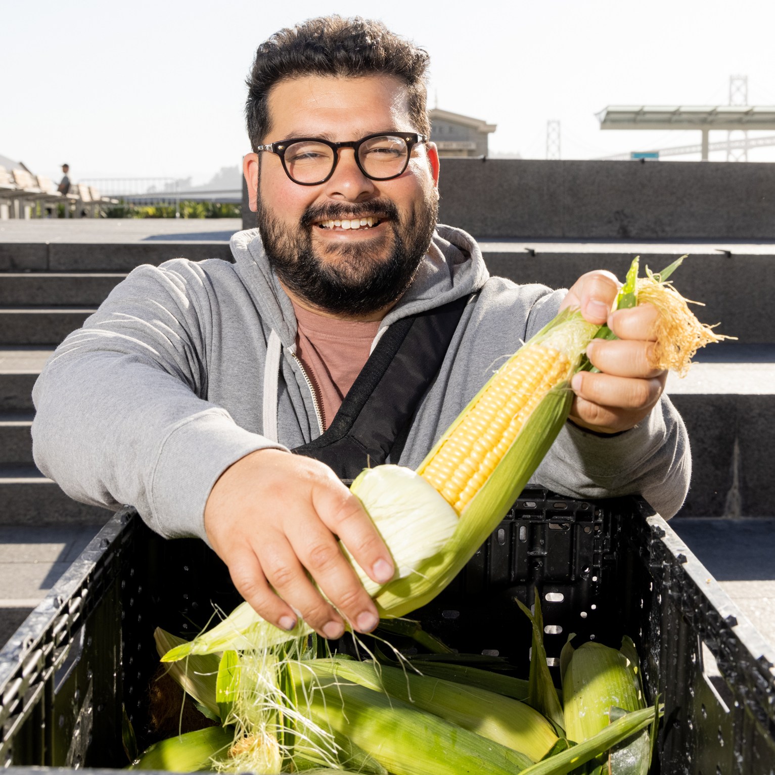 Chef Nico Pena of Octavia holding Brentwood corn