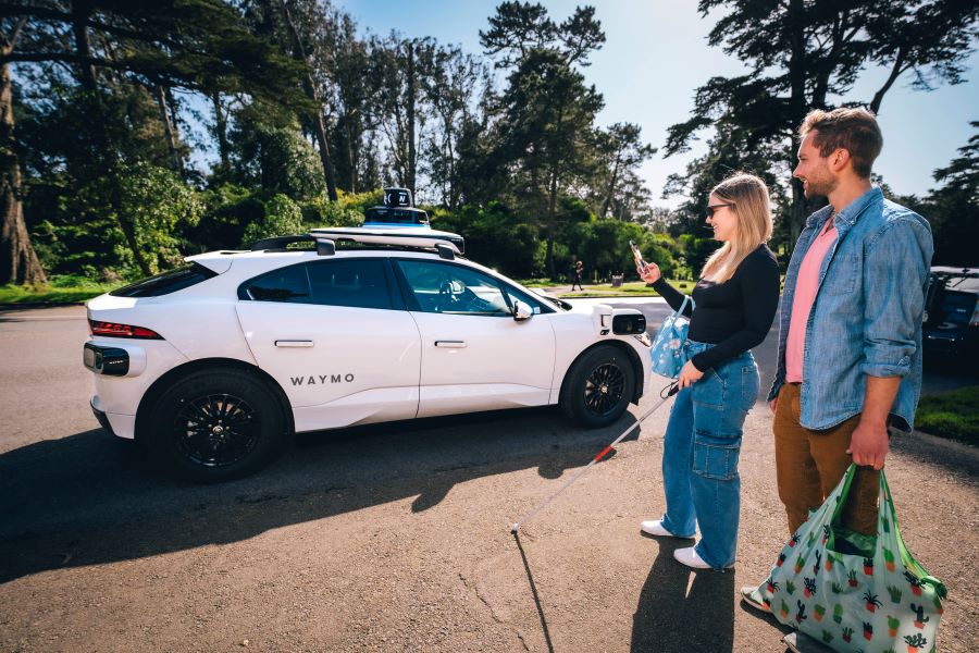 Jessie Wolinksy and her boyfriend Nick preparing to enter a Waymo in Golden Gate Park.