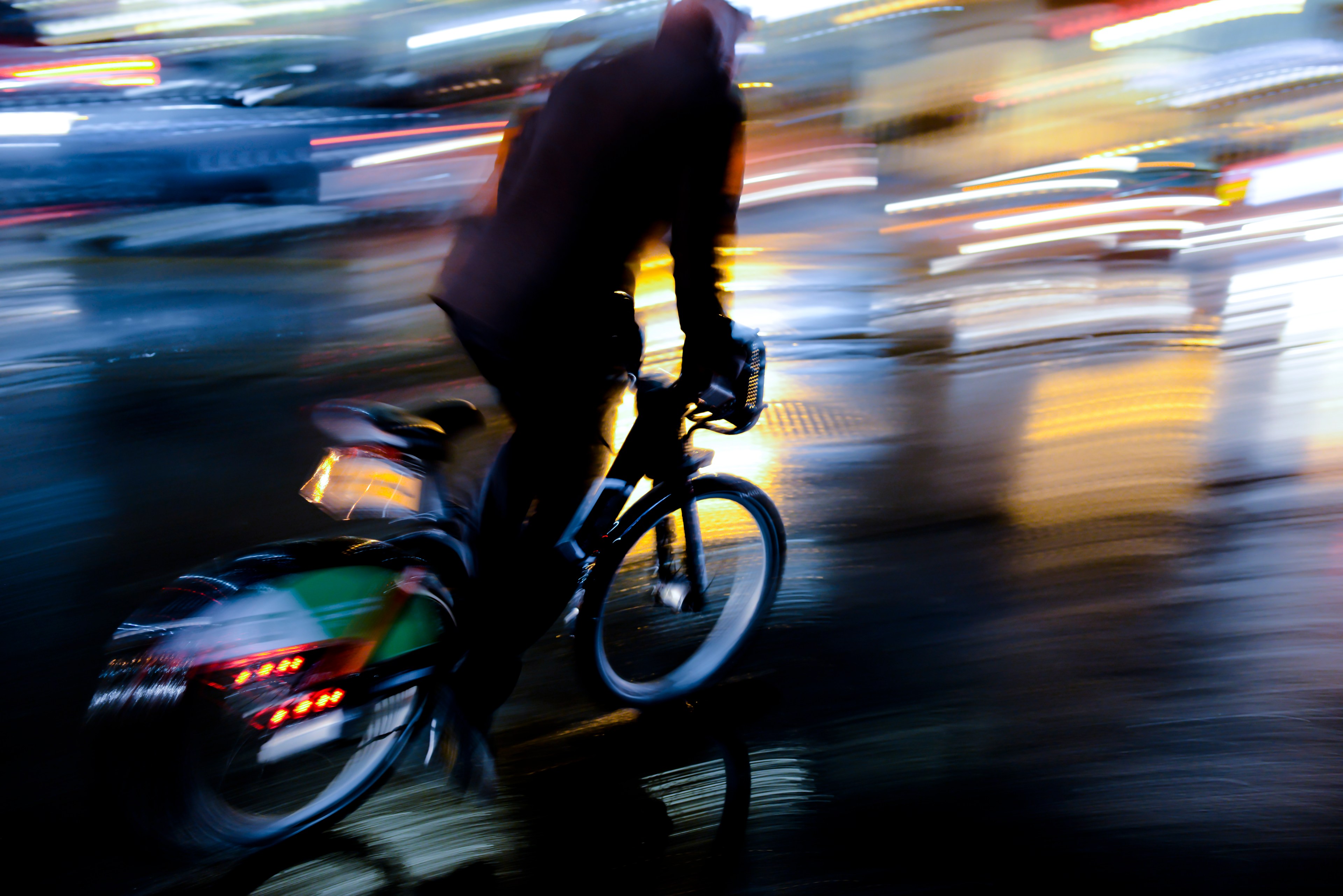 A man cycling in blurred motion